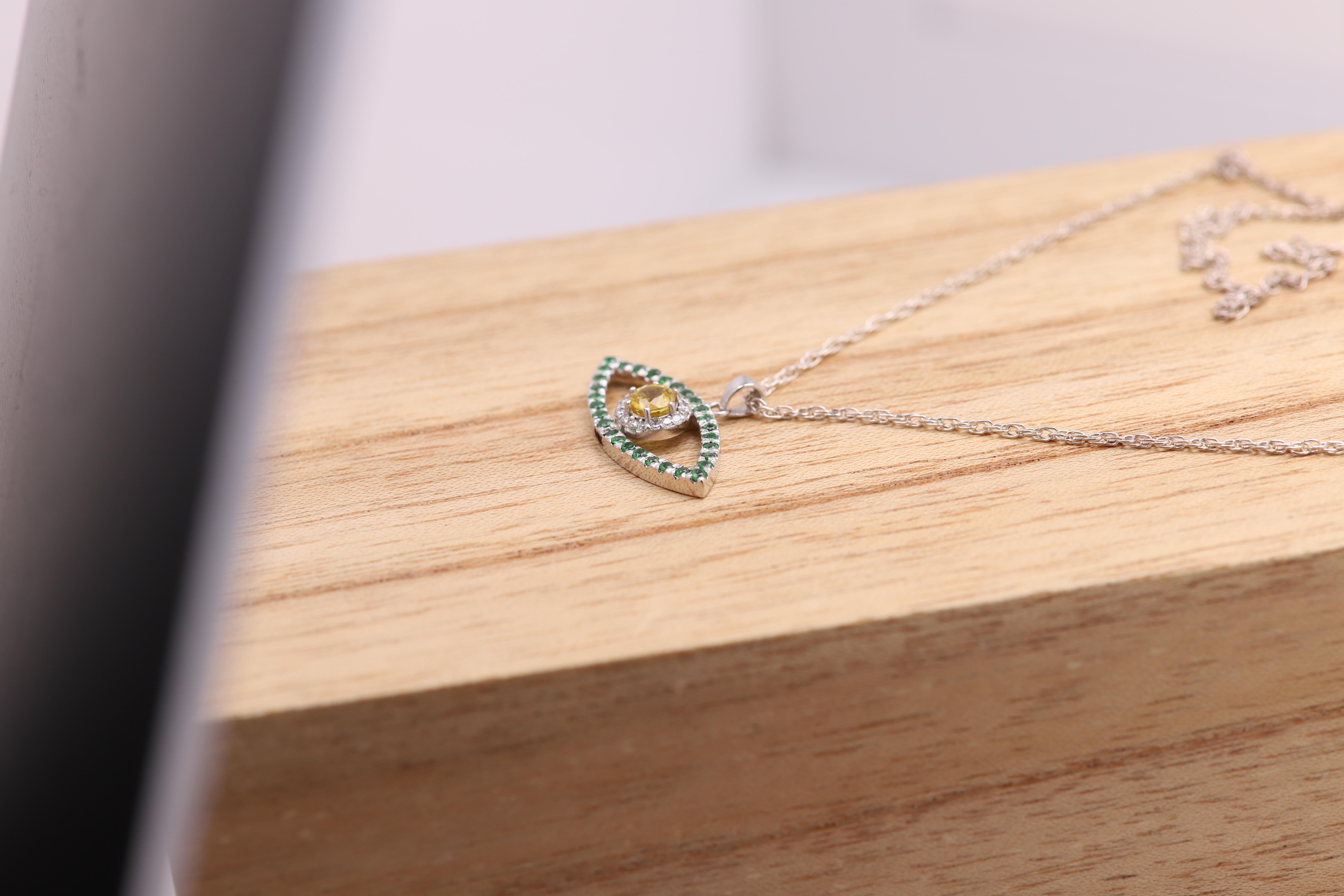 Donna Malocchio d'oro 14 carati in oro bianco con zaffiro giallo e tsavorite verde in vendita