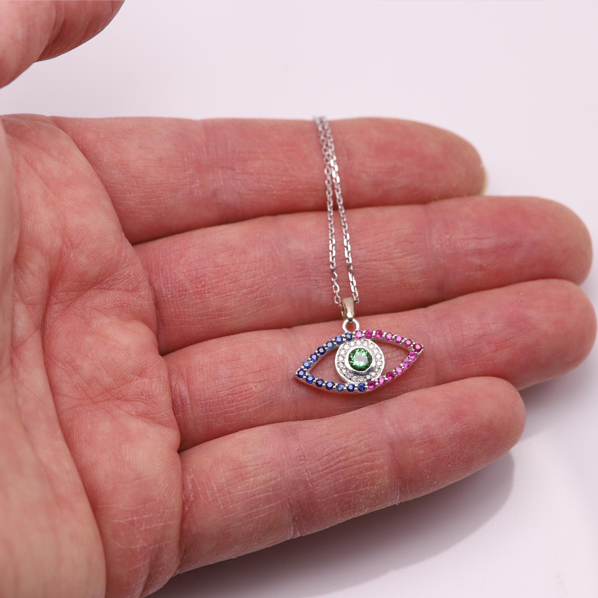 Women's Gold Evil Eye 14 Karat White Gold Green Tsavorite Red and Blue Sapphire For Sale