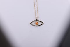 Gold Evil Eye 14 Karat Yellow Gold Black Diamonds and Orange Sapphire