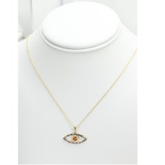 Gold Evil Eye 14 Karat Yellow Gold Black Diamonds and Orange Sapphire