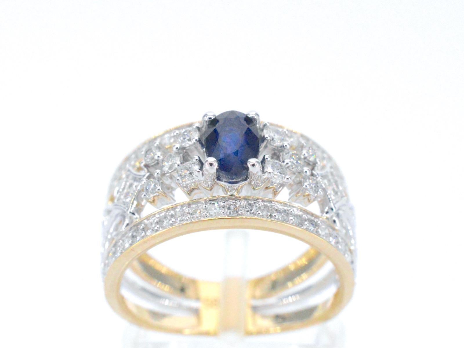 This exclusive gold ring is a stunning piece of jewelry that features dazzling diamonds and a beautiful sapphire. The diamonds are expertly set in the gold band to create a seamless and elegant look that is sure to catch the eye. The sapphire adds a