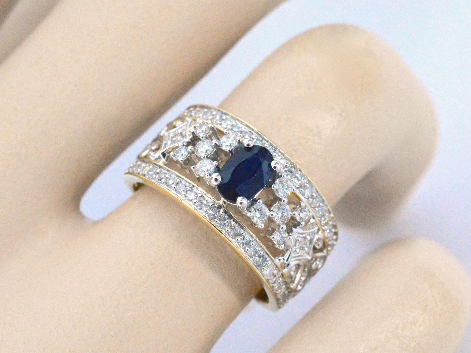 Contemporary Gold Exclusive Ring Full of Diamonds and a Sapphire For Sale