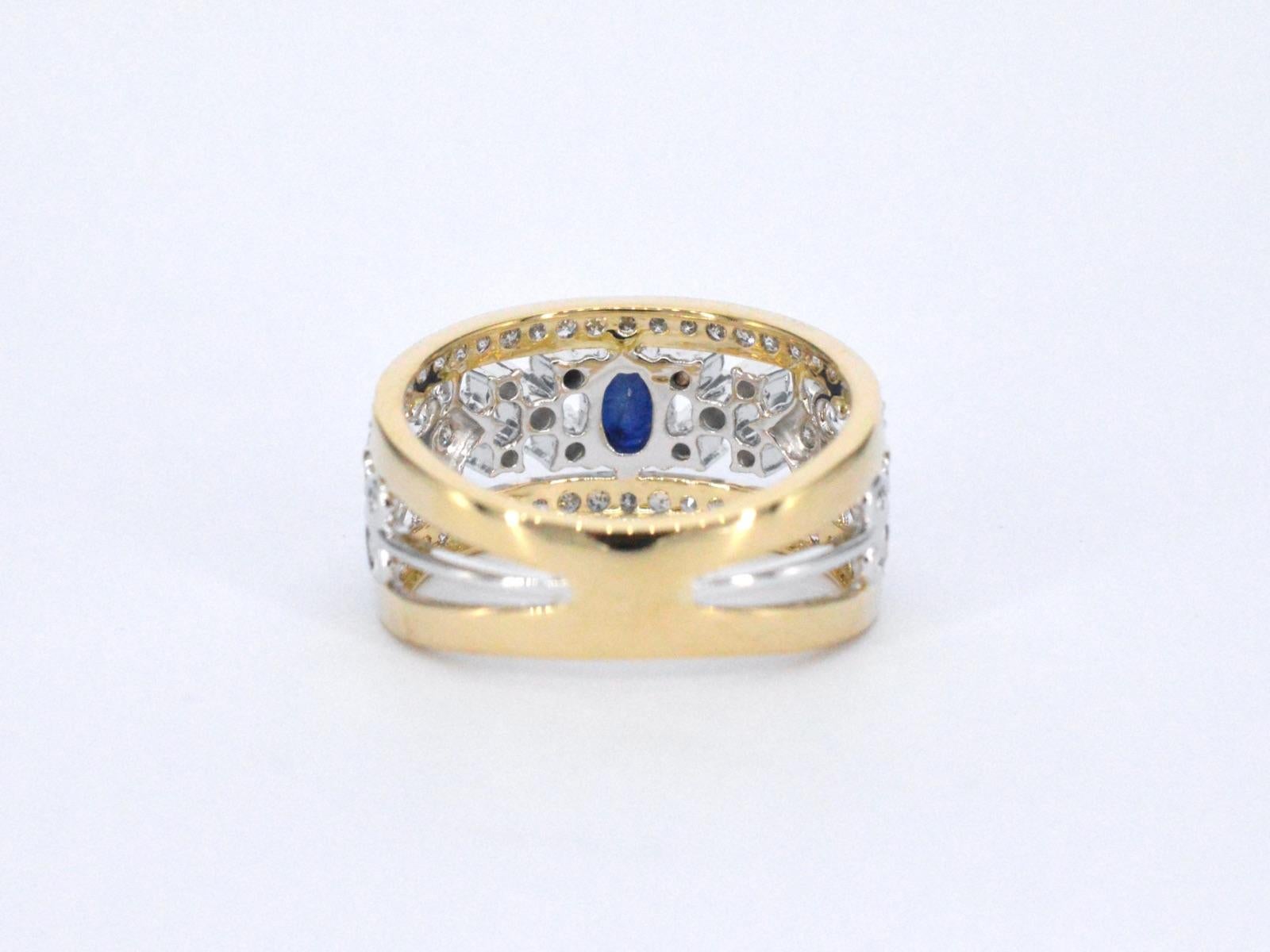 Gold Exclusive Ring Full of Diamonds and a Sapphire For Sale 1