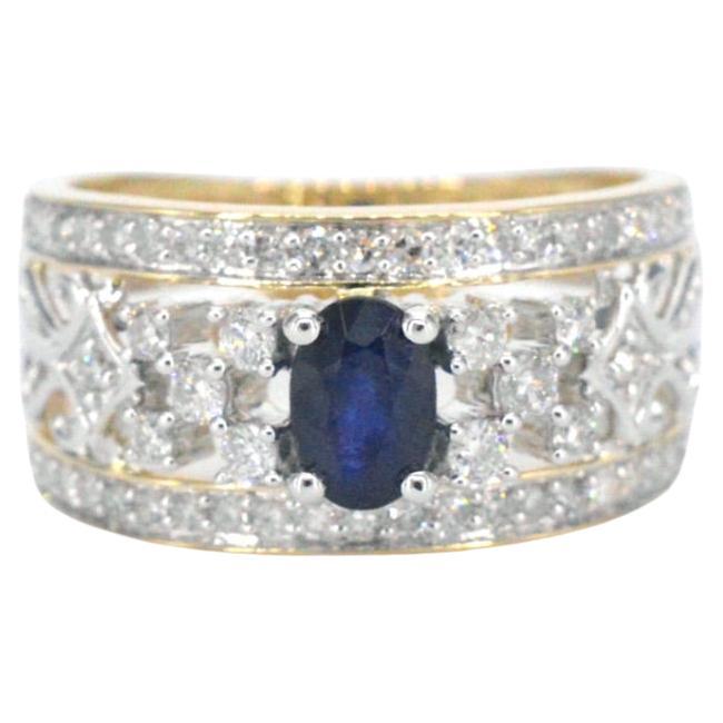 Gold Exclusive Ring Full of Diamonds and a Sapphire For Sale