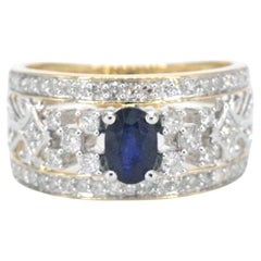 Gold Exclusive Ring Full of Diamonds and a Sapphire