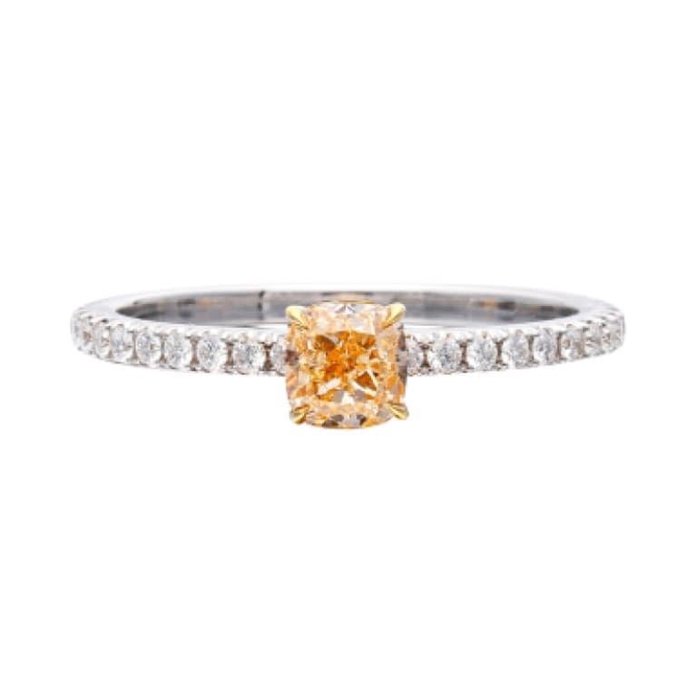 Centering a 0.51 carat Fancy Yellowish-Orange diamond, accented by 30 round brilliant cut diamonds.

Fancy Yellowish-Orange diamond weighs 0.51 carat
Round diamonds weighing a total of approximately 0.30 carat
Size 6 1/2
Total weight 1.93 grams
18