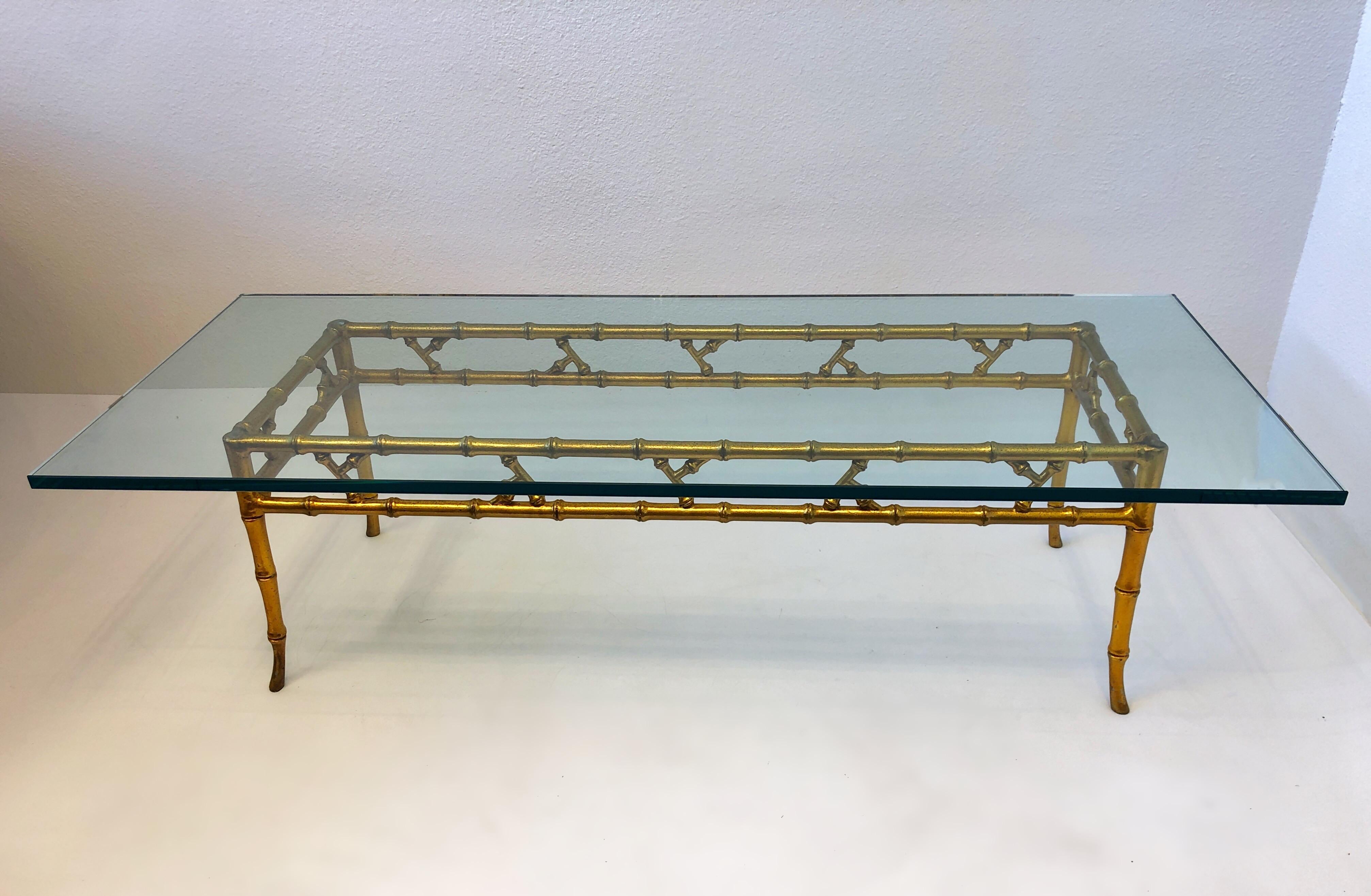1970’s Gold Faux bamboo coffee table by Brown Jordan.
Constructed powder coated aluminum and 3/4” thick glass top. 
Original condition with minor wear consistent with age. 
Measurements: 58” Wide, 24” Deep, 15.38” High.