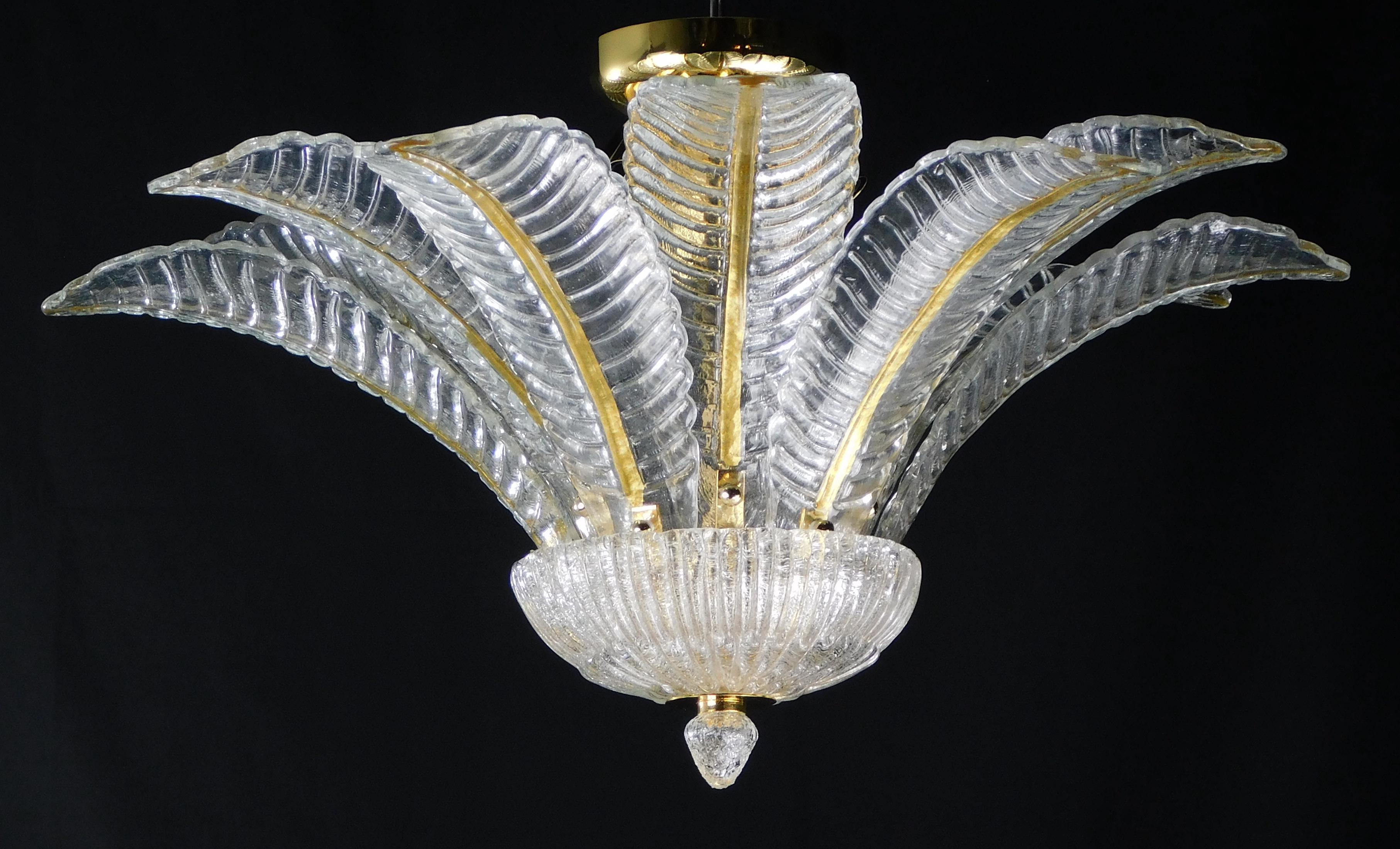 Italian flush mount with clear hand blown Murano Felci fern glass leaves infused with gold, mounted on 24 k gold finish metal frame by Fabio Ltd / Made in Italy
6 lights / E12 or E14 type / max 40W each
Measures: Diameter 27.5 inches, height 14