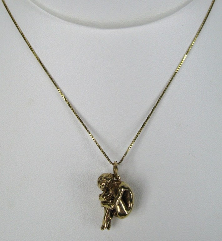 Woman in  Crouched position. 14K Gold Chain and Pendant. Measures Pendant .72