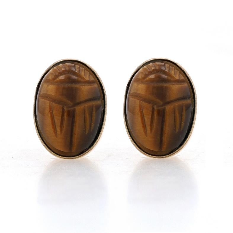 Metal Content: 1/20 12k Gold Filled

Stone Information
Natural Tiger's Eye
Cut: Carved Scarab Oval Cabochon
Color: Brown & Tan

Style: Stud
Fastening Type: Non-Pierced Screw-On Closures

Measurements
Tall: 19/32