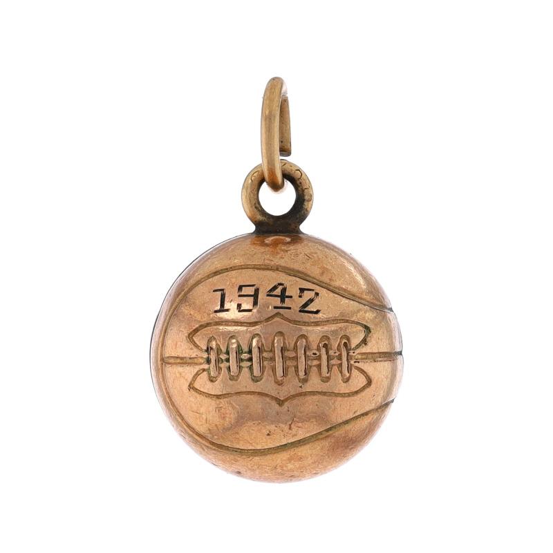 Era: Vintage
Date: 1942

Metal Content: Gold Filled

Style: Charm
Theme: Basketball, Sports
Features: Hollow Construction with Etched Detailing

Measurements

Tall (from stationary bail): 23/32