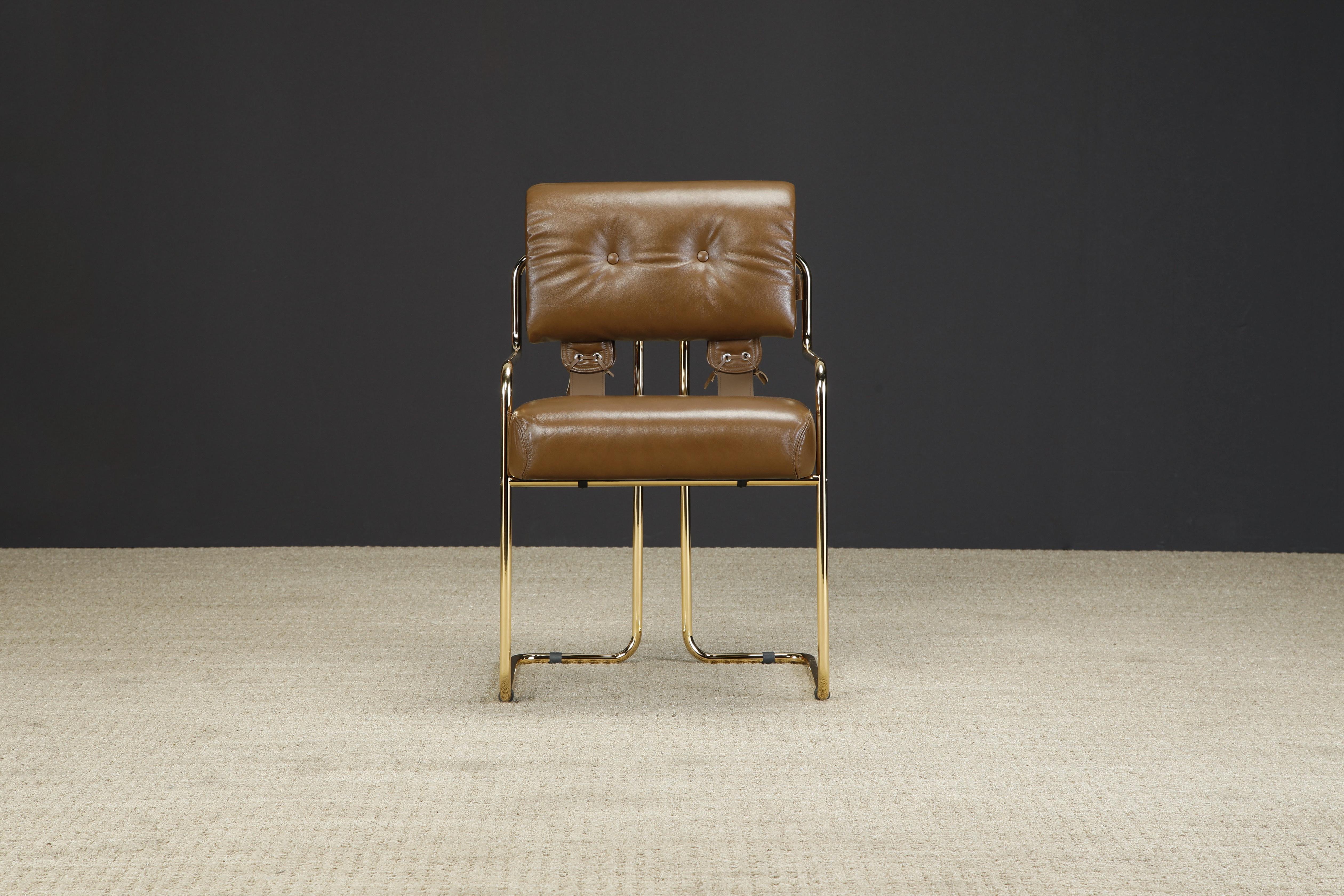 Currently, the most coveted dining chairs by interior designers are 'Tucroma' chairs by Guido Faleschini for i4 Mariani, and we have this incredible special edition Tucroma armchair in smooth brown leather with polished gold finish frames completed