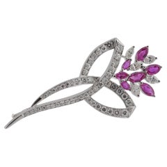 Goldblumenbrosche mit Ceylon-Rubinen (No Heat) 
Diamanten Weißgold