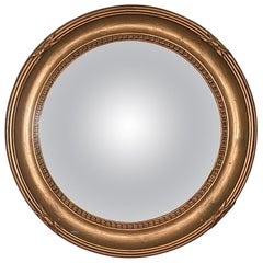 Miroir en verre convexe à cadre arrondi et feuille d'or:: France:: années 40