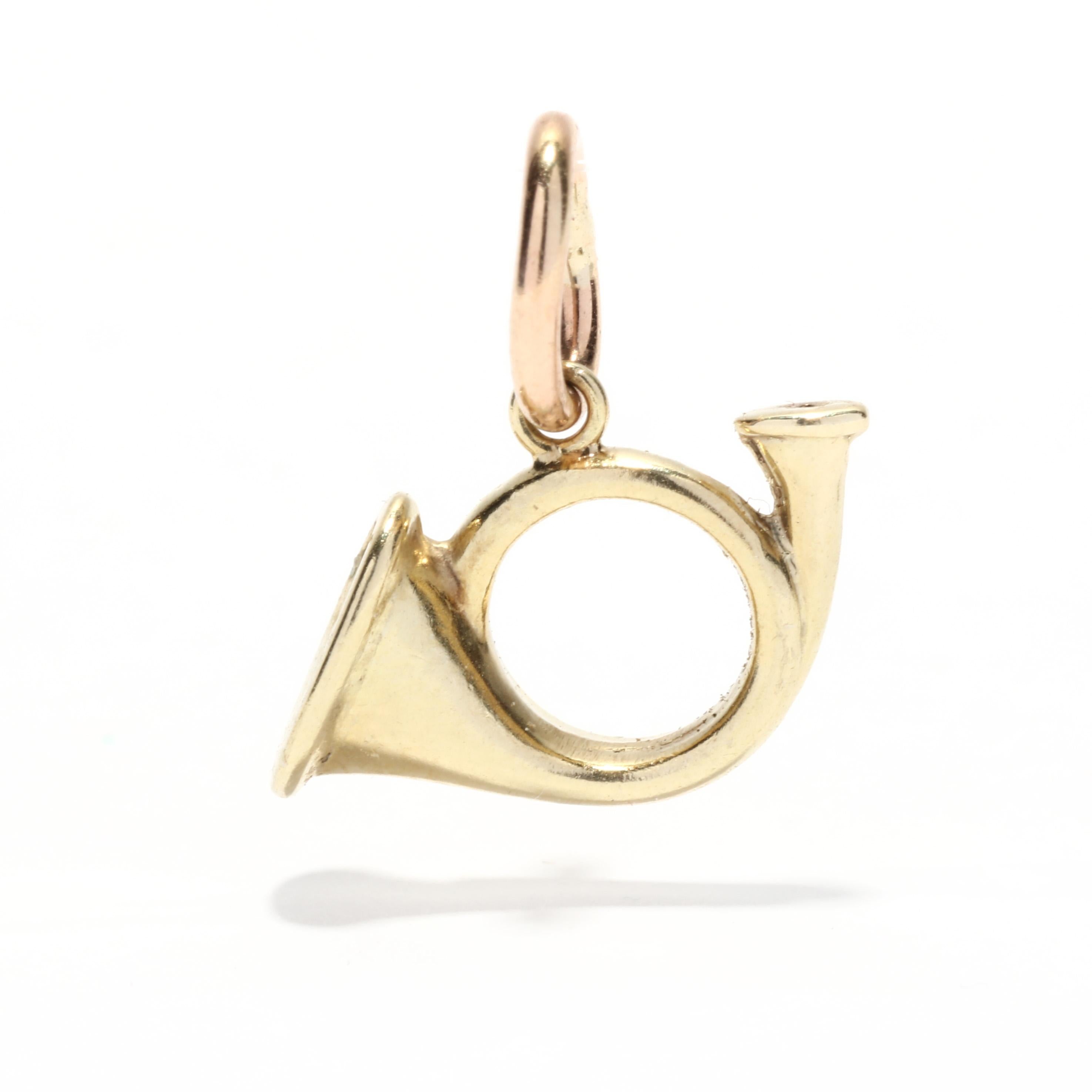 A vintage 14 karat yellow gold French horn charm. This small charm features a circular French horn motif with a thin bail.

Length: 9/16 in.

Width: 5/8 in.

Weight: .50 dwts.


Ring Sizings & Modifications:
* We are happy to assist in any ring