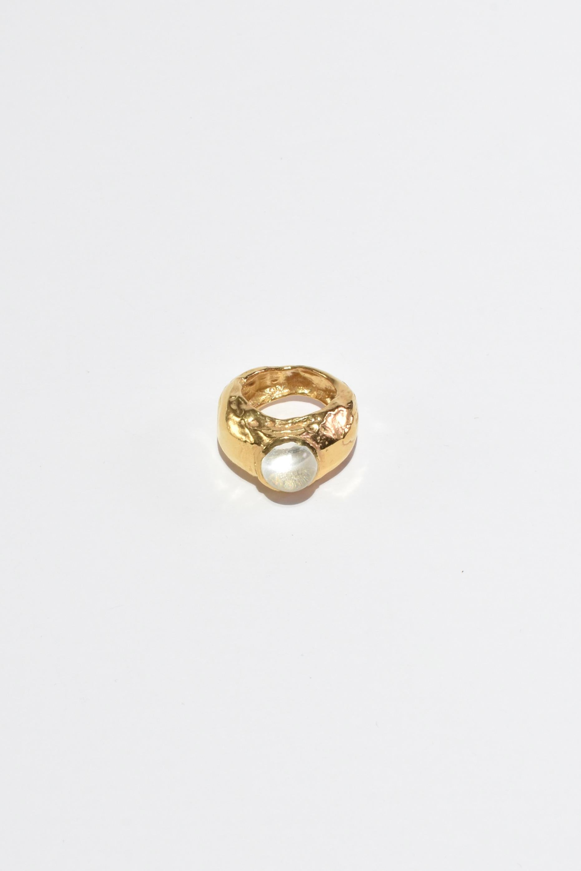 Handmade gold plate organic shaped ring with a crystal cabochon. Handcrafted in Valencia, Spain by Simuero.

Material: 18k gold plate, sterling silver, crystal.