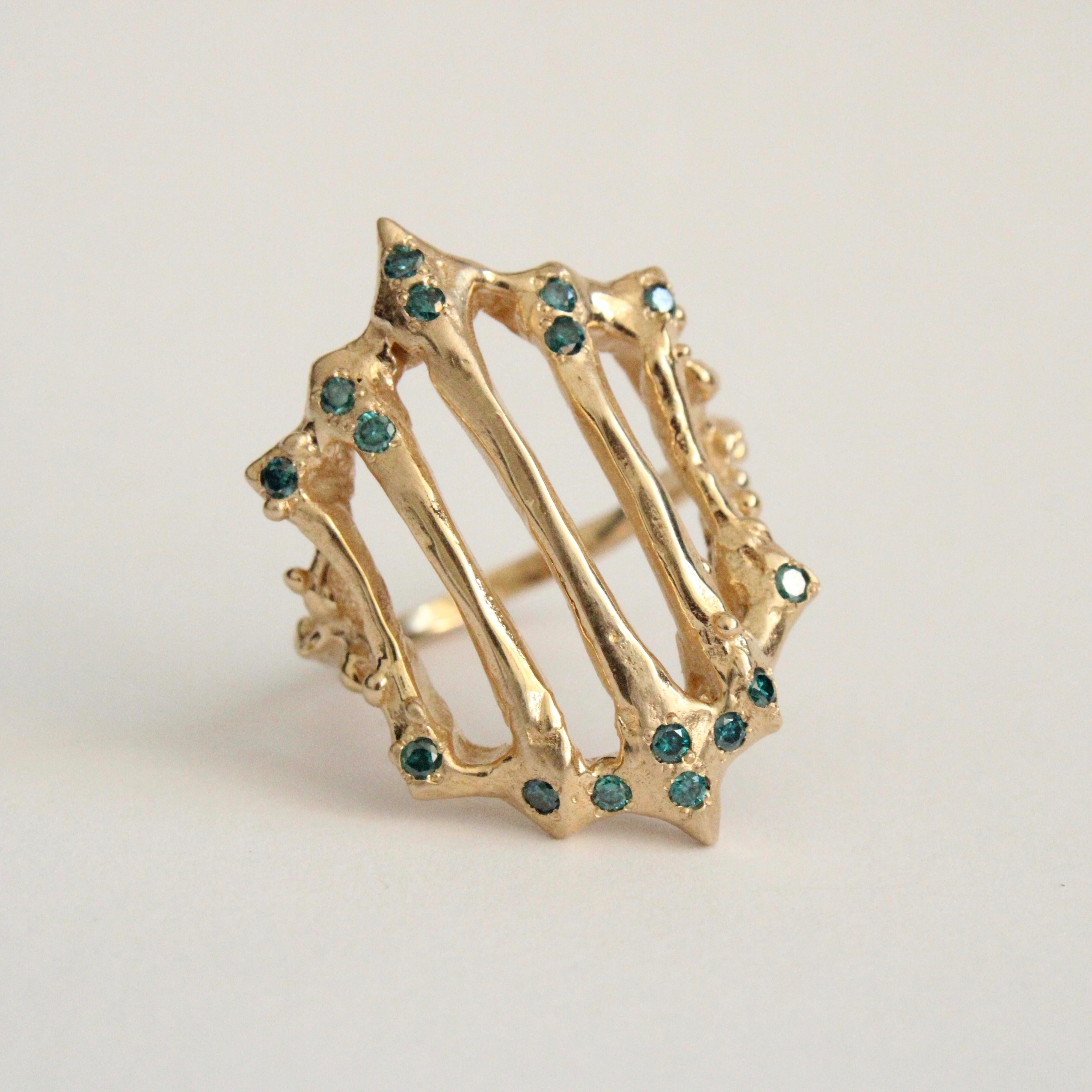 14k gold gate ring with 16 pave set blue diamonds.  Fashioned after old iron gates, this piece is substantial on the hand measuring about 1 inch from top to bottom. Solid 14k yellow gold . This unisex style is a stand alone, gorgeous piece. Stones