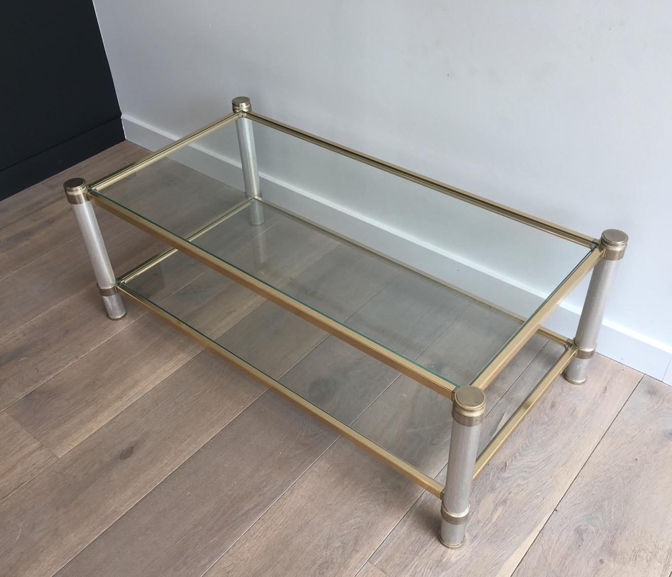 This coffee table is made of gilt and silver color aluminium with fluted legs. This cocktail table is signed by famous French designer Pierre Vandel. Circa 1970 
