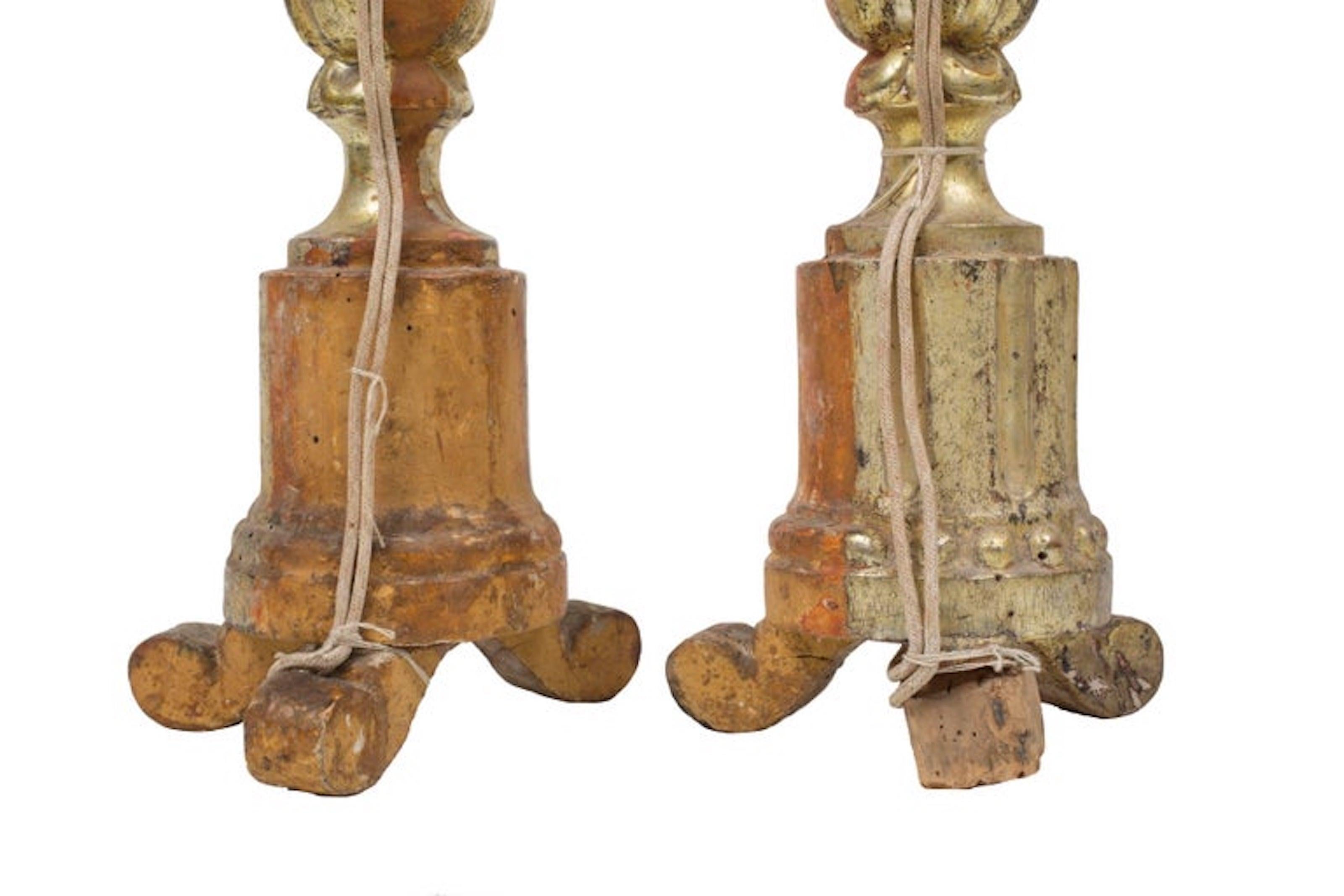 Pair of 19th Century Italian Candlesticks with beautiful original gild from Italian altar of the Church. Front is gilded while the back the original wood because only the front was seen from the altar. Cork and wood like material legs show