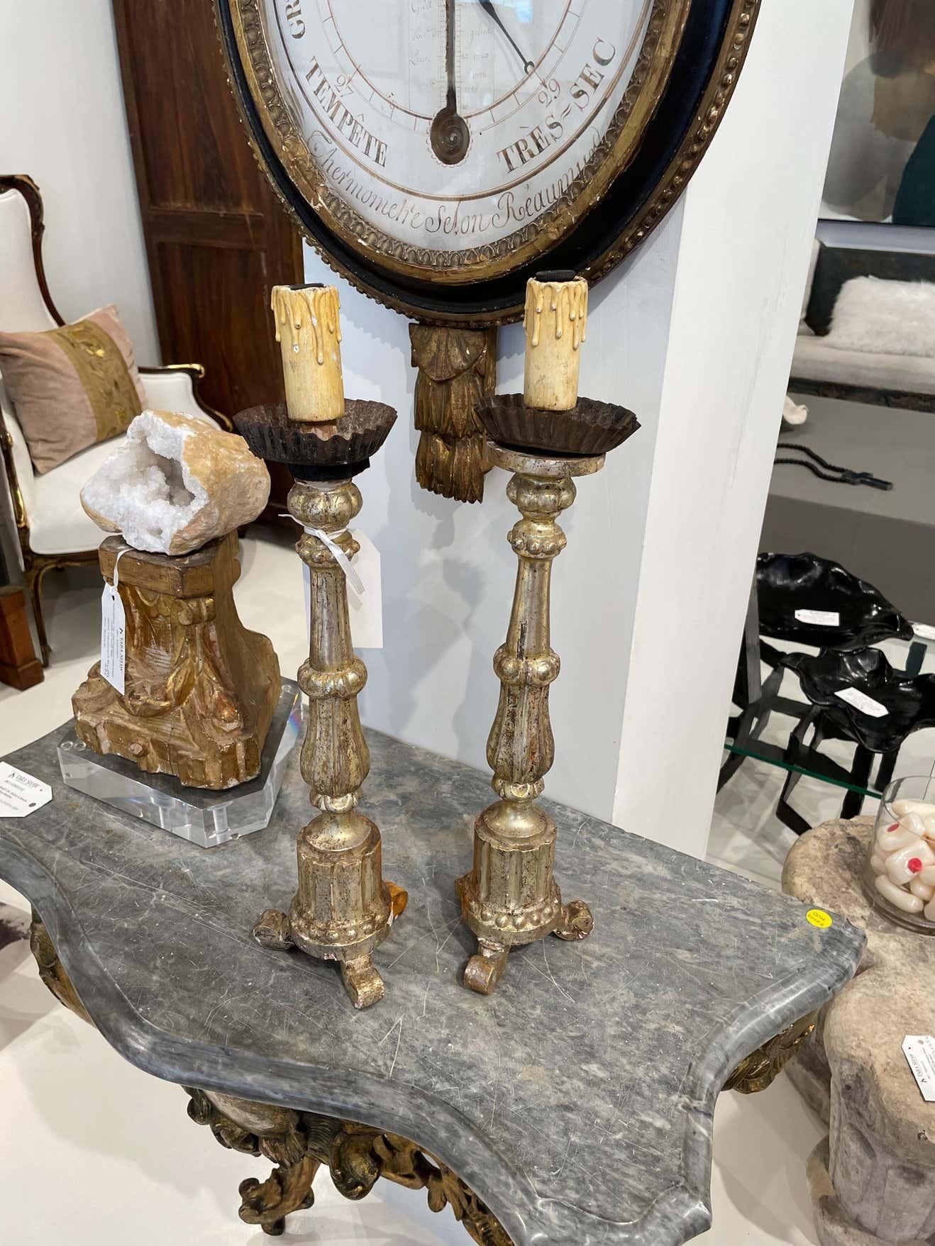 Pair of 19th century Italian Candlesticks with beautiful original gild from Italian altar of the Church. Front is gilded while the back the original wood because only the front was seen from the altar. Cork and wood like Material legs show