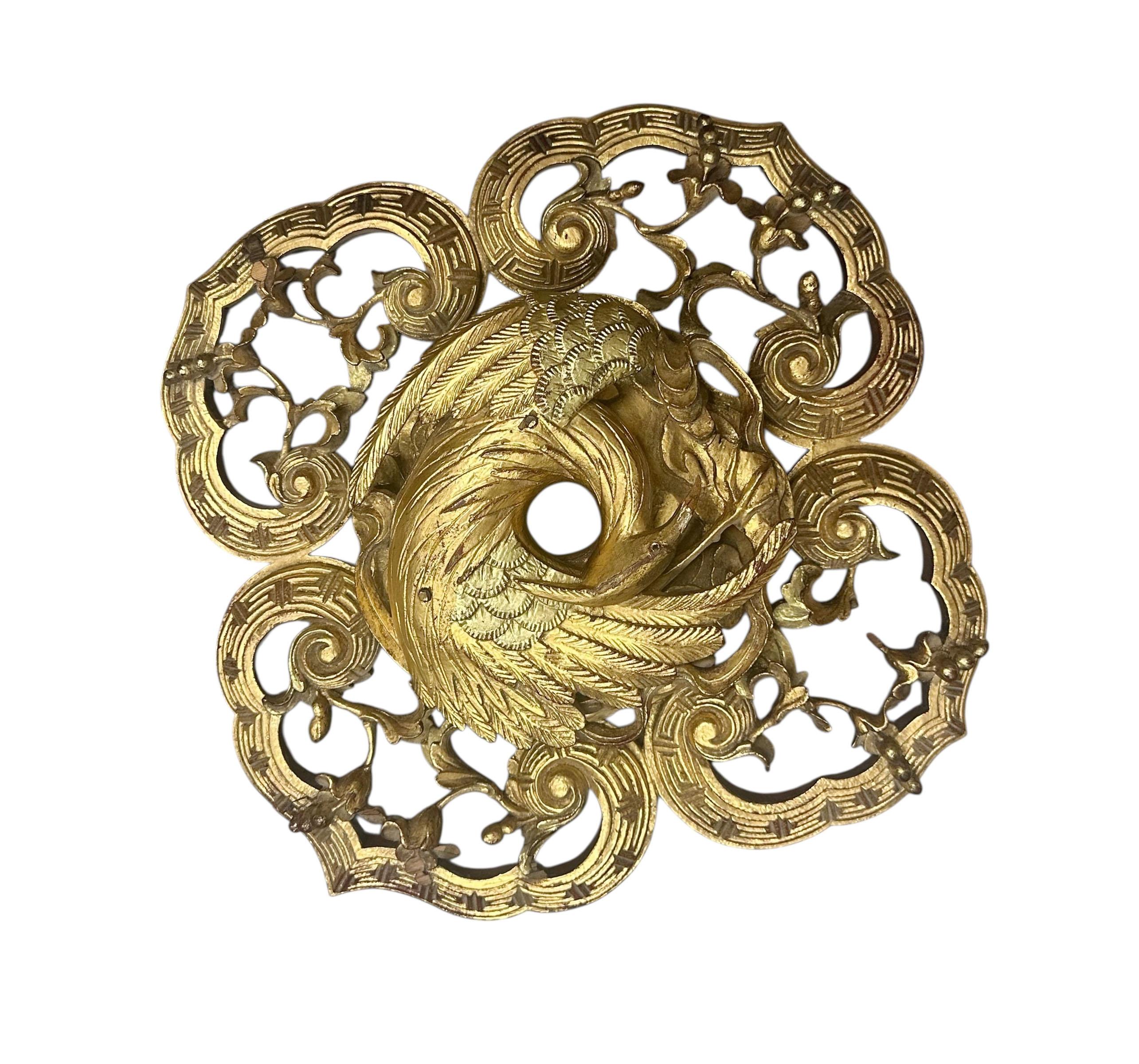 n exquisite Chinese architectural fragment, richly detailed in gold gilt with subtle traces of silver. This hand carved piece features a stylized bird soaring among swirling clouds a powerful symbol of transcendence and harmony in traditional