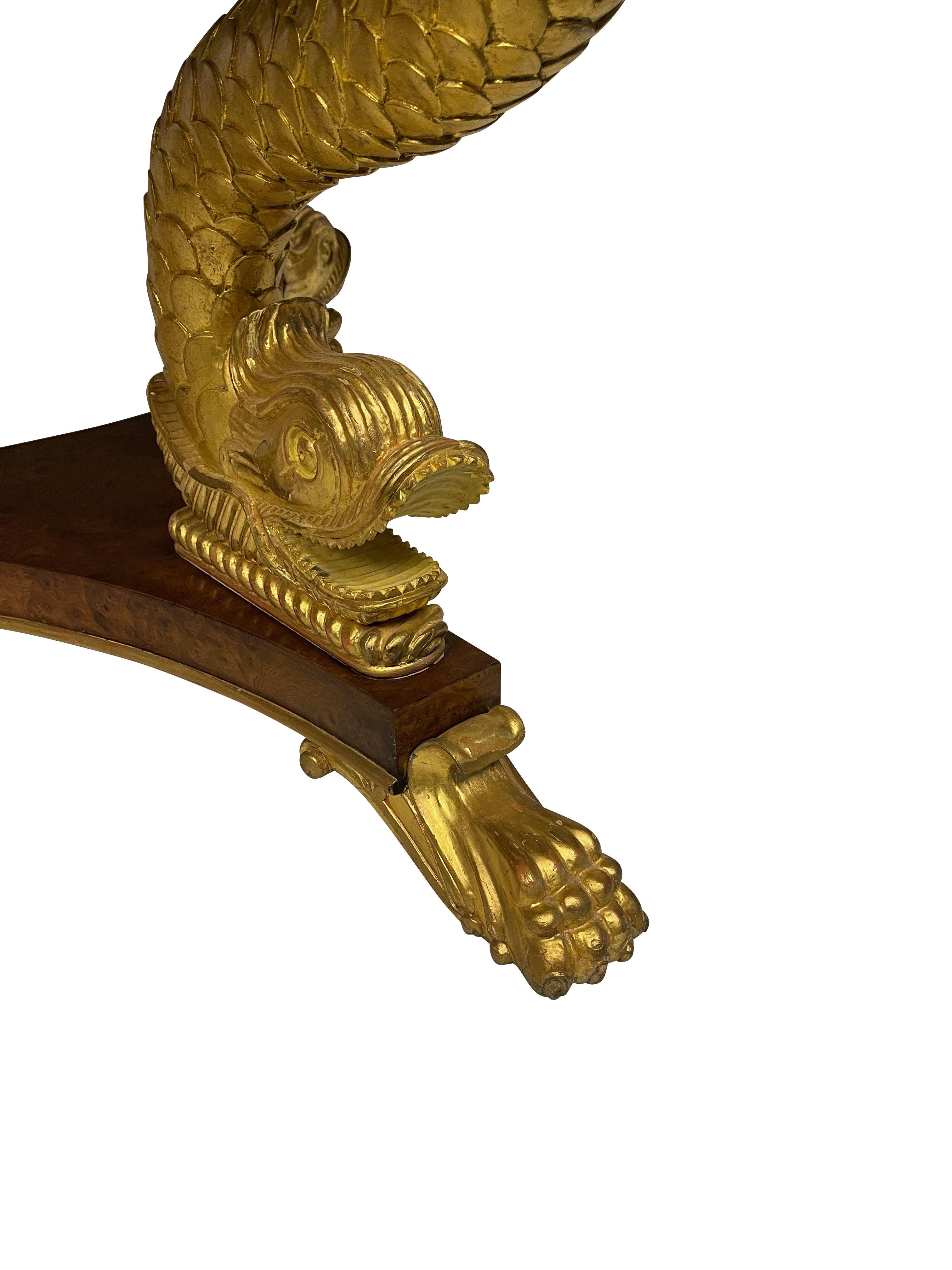 Mid-20th Century Smith and Watson Center Table with Gold Gilt Decorated Dolphin Base For Sale