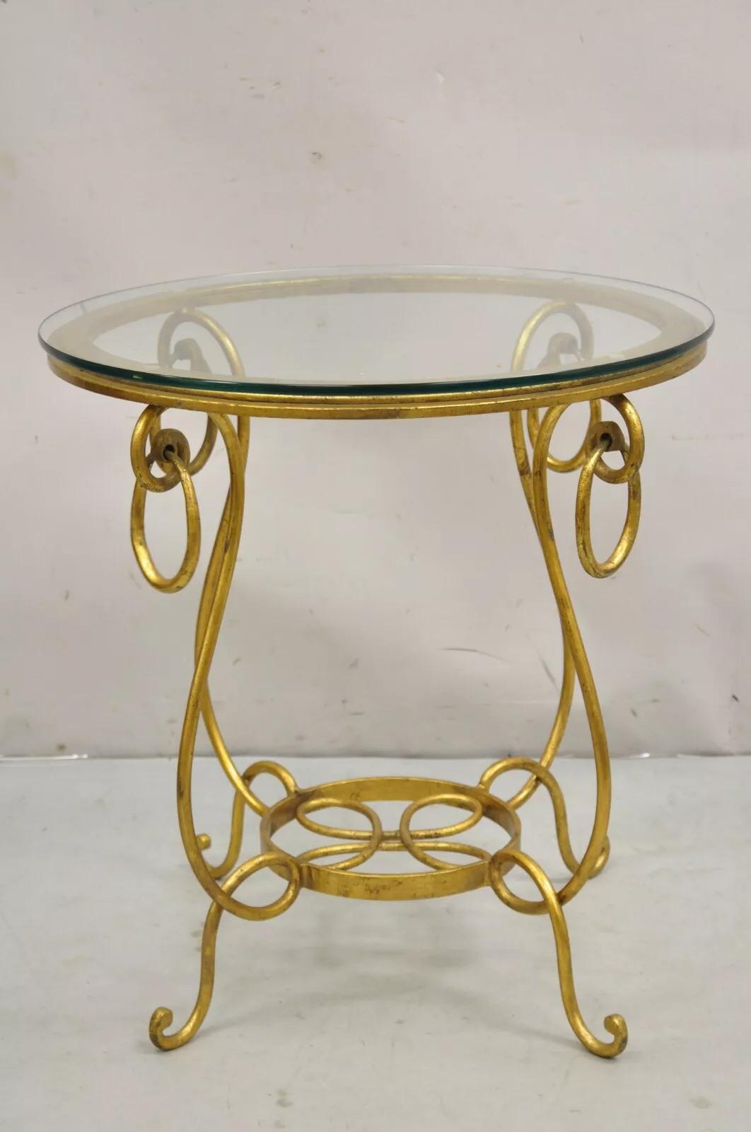 Mesa auxiliar redonda de hierro dorado estilo René Drouet. Finales del siglo XX. Medidas: 25