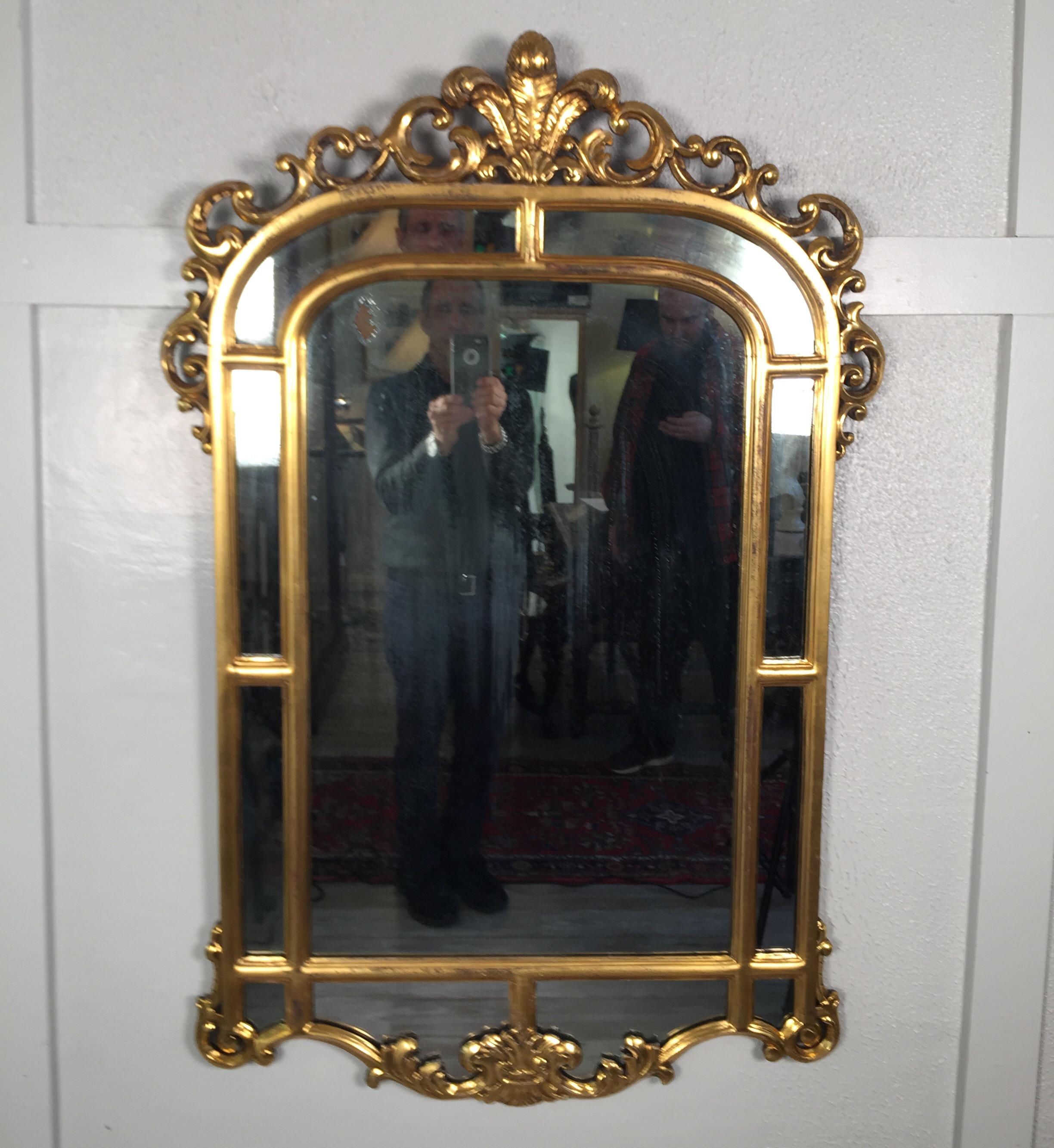 Gold gilt French style mirror in original condition, mirror has age appropriate loses to the silver. Nice gilt mirror in original condition for the purist, circa 1890s.
Dimensions: 33