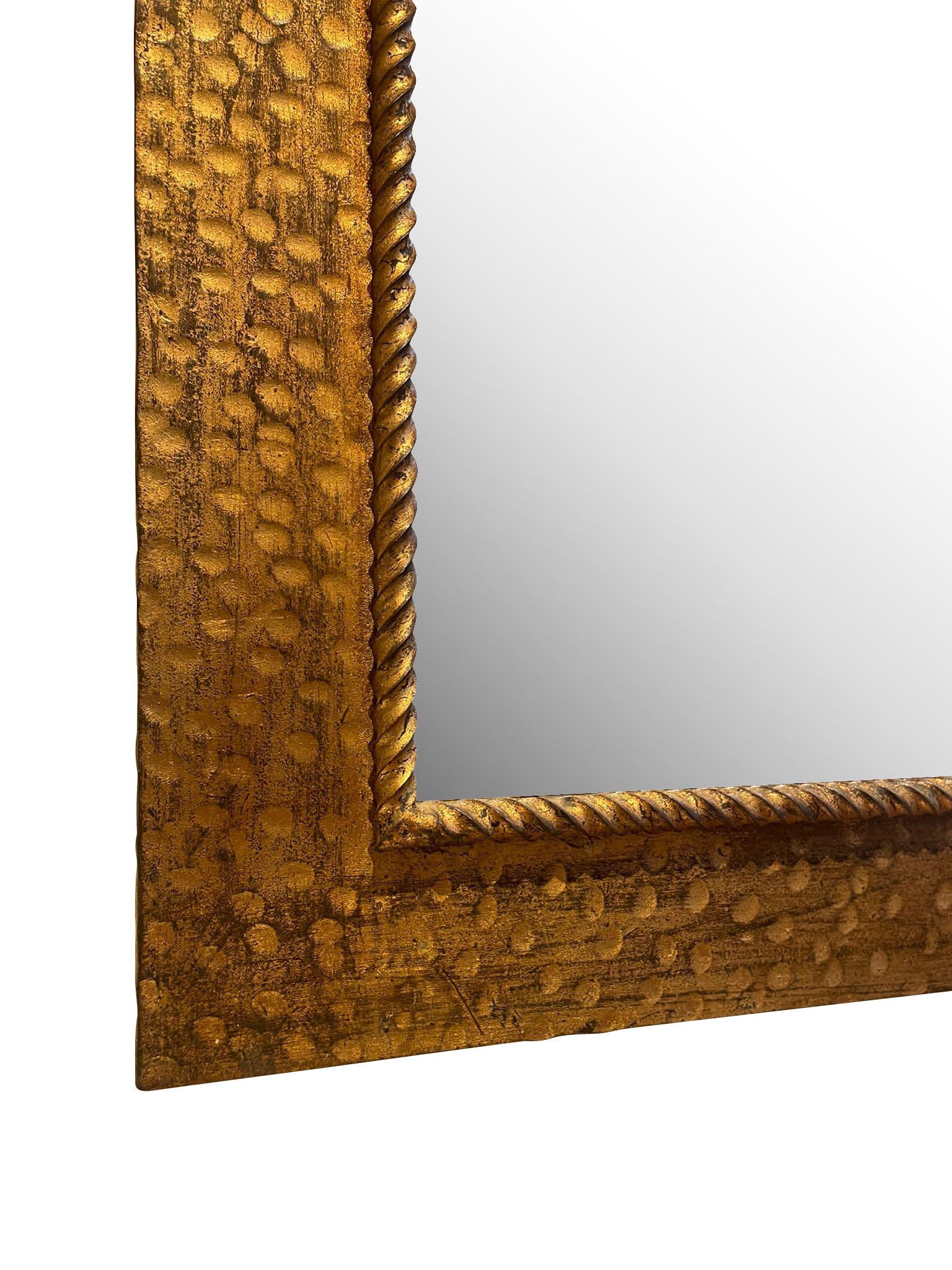 1950's Spanish gold gilt metal frame mirror.
Hammered decorative detailing.
Thin twisted rope edge.
ARRIVING NOVEMBER.