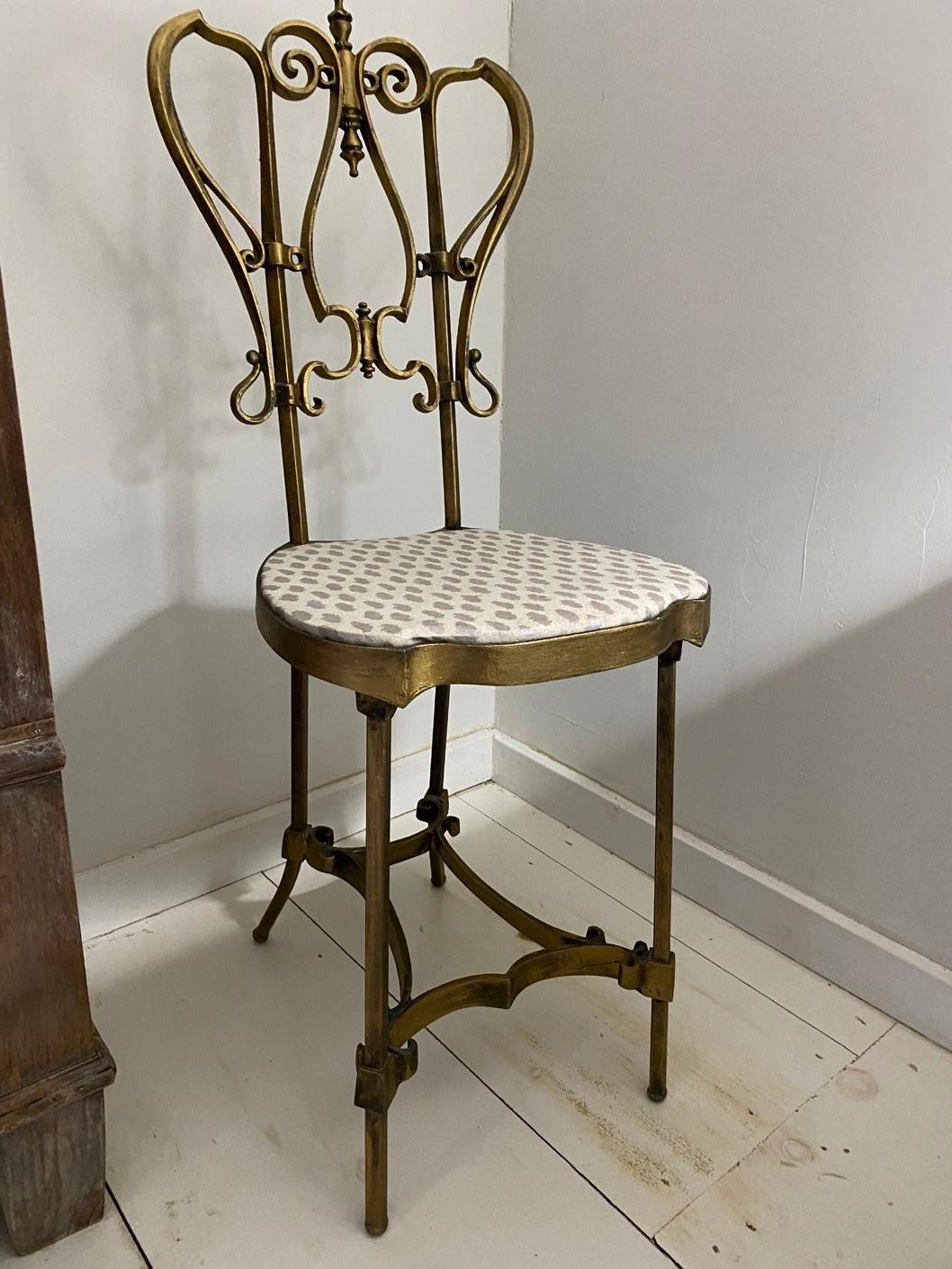 Petite Italian stool or side chair in gilt wrought iron, perfect for the dressing room, bedroom or vanity. This metal chair can be a standalone sculptural piece in any room or setting.