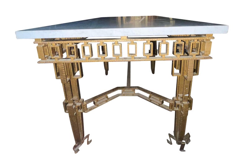 1960's Spanish gold gilt iron console table in the style of Jean Royere.
Interesting decorative detailing on the apron, stretchers and legs.
Thick white marble top.
Can also be used as a center hall table.
Coordinating mirror also available