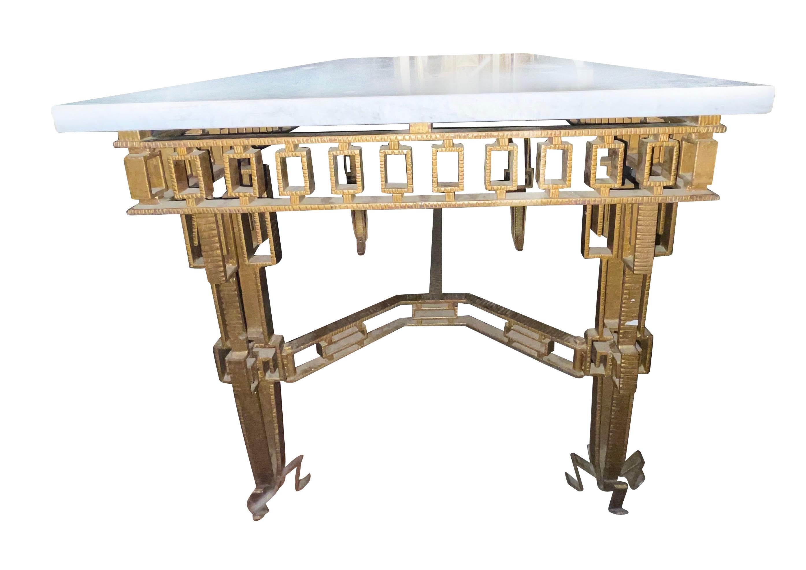 1960's Spanish gold gilt iron console table in the style of Jean Royere.
Interesting decorative detailing on the apron, stretchers and legs.
Thick white marble top.
Can also be used as a center hall table.
Coordinating mirror also available
