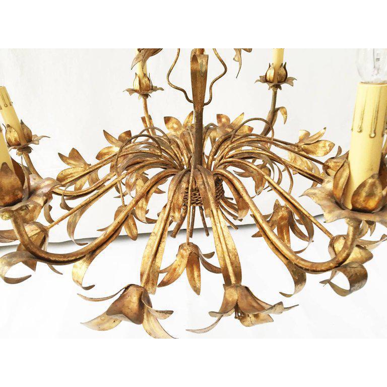 Beautiful Italian tole lily six-light chandelier in gold gilt. Unusual shape that adds a modern touch to a Classic fixture. No markings. Very good vintage condition with only very minor imperfections consistent with age. 
 