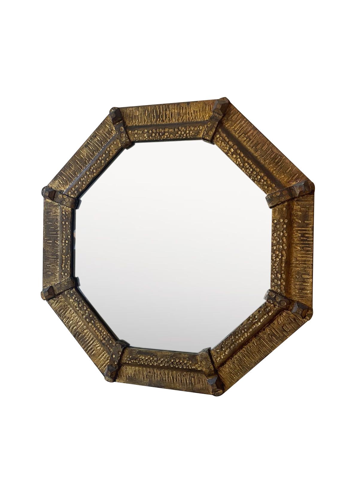 1950's Spanish octagonal shape mirror in gold gilt metal frame.
Decorative hammered design.
 