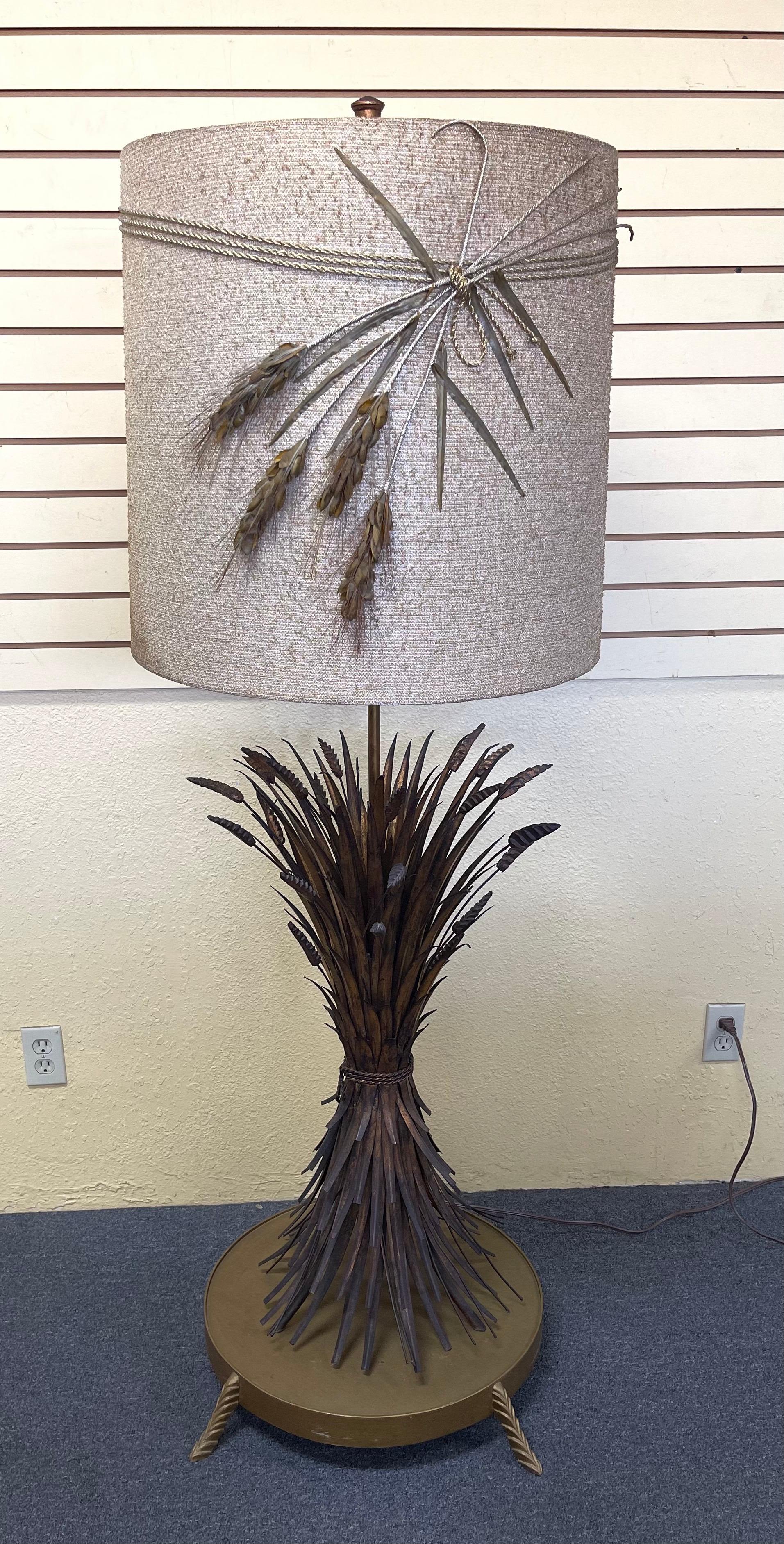 Very stylish gold gilt sheaf of wheat Italian floor lamp with original shade circa, 1950s. The floor version of this iconic sheaf of wheat deign lamp is quite rare and the fact that it has the original shade makes it even more desireable! The lamp