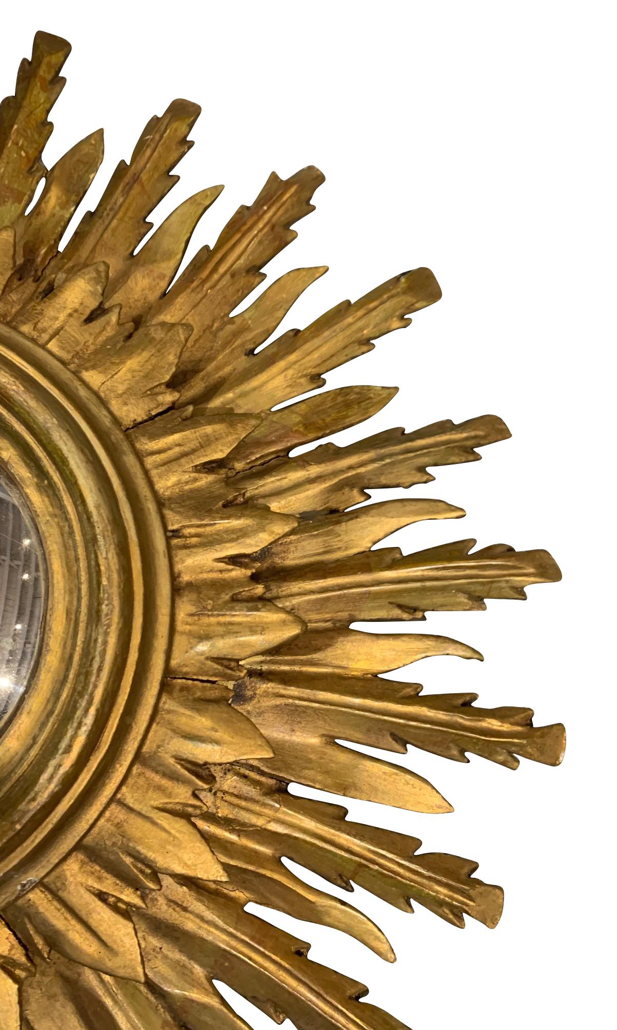 1920's Spanish gold gilt wooden frame in starburst design.
Three spoke layer design.
Convex mirror.
Beautiful natural patina.
Three different starburst designs available.
