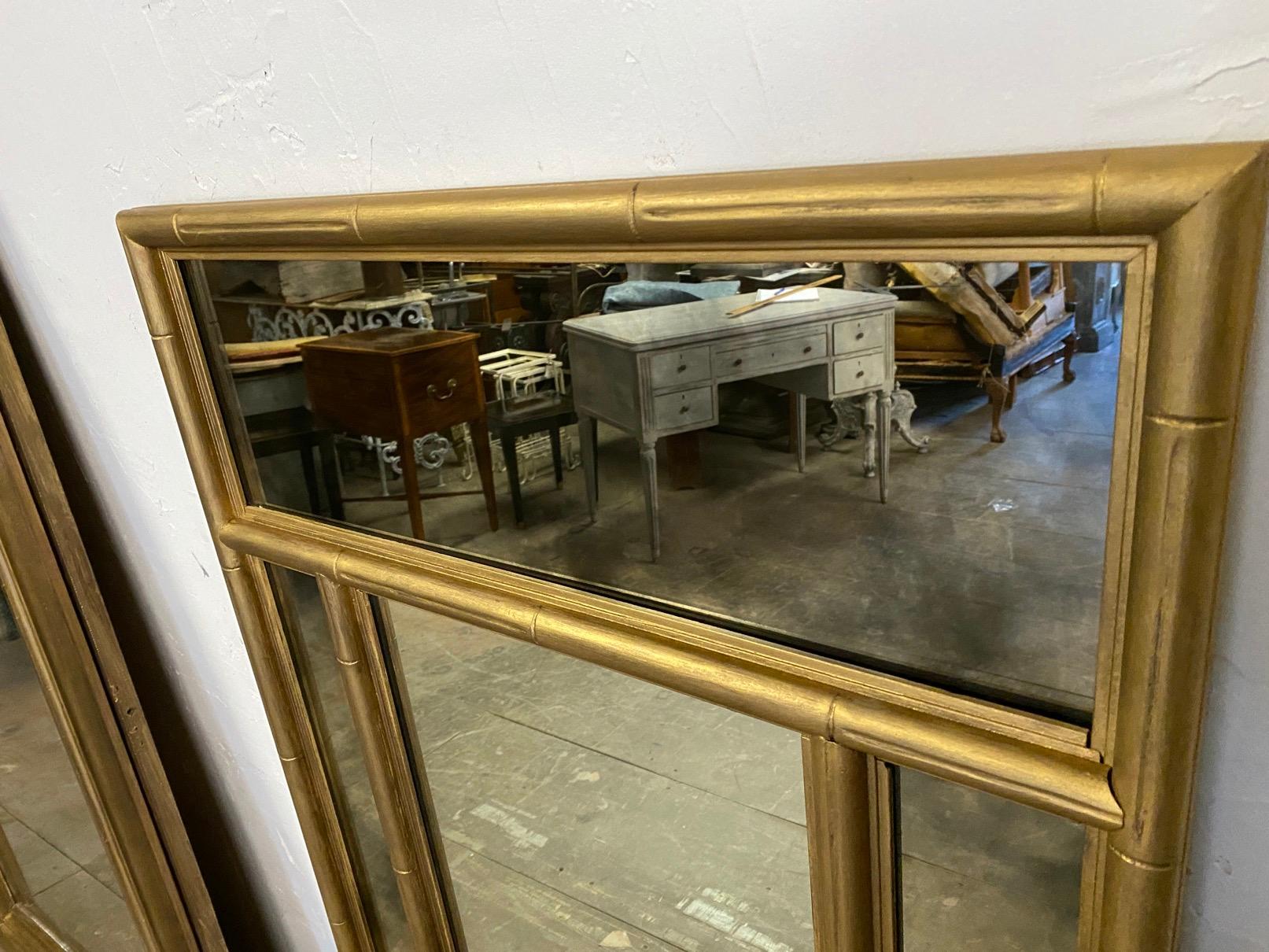 Contemporary Italian Chinoiserie in the Chippendale style gold gilt wood mirror with divided sections. The top and side panels have darkened distressed mirror for added interest.
Search terms: wall mirror, mantle mirror, dressing table mirror, hall