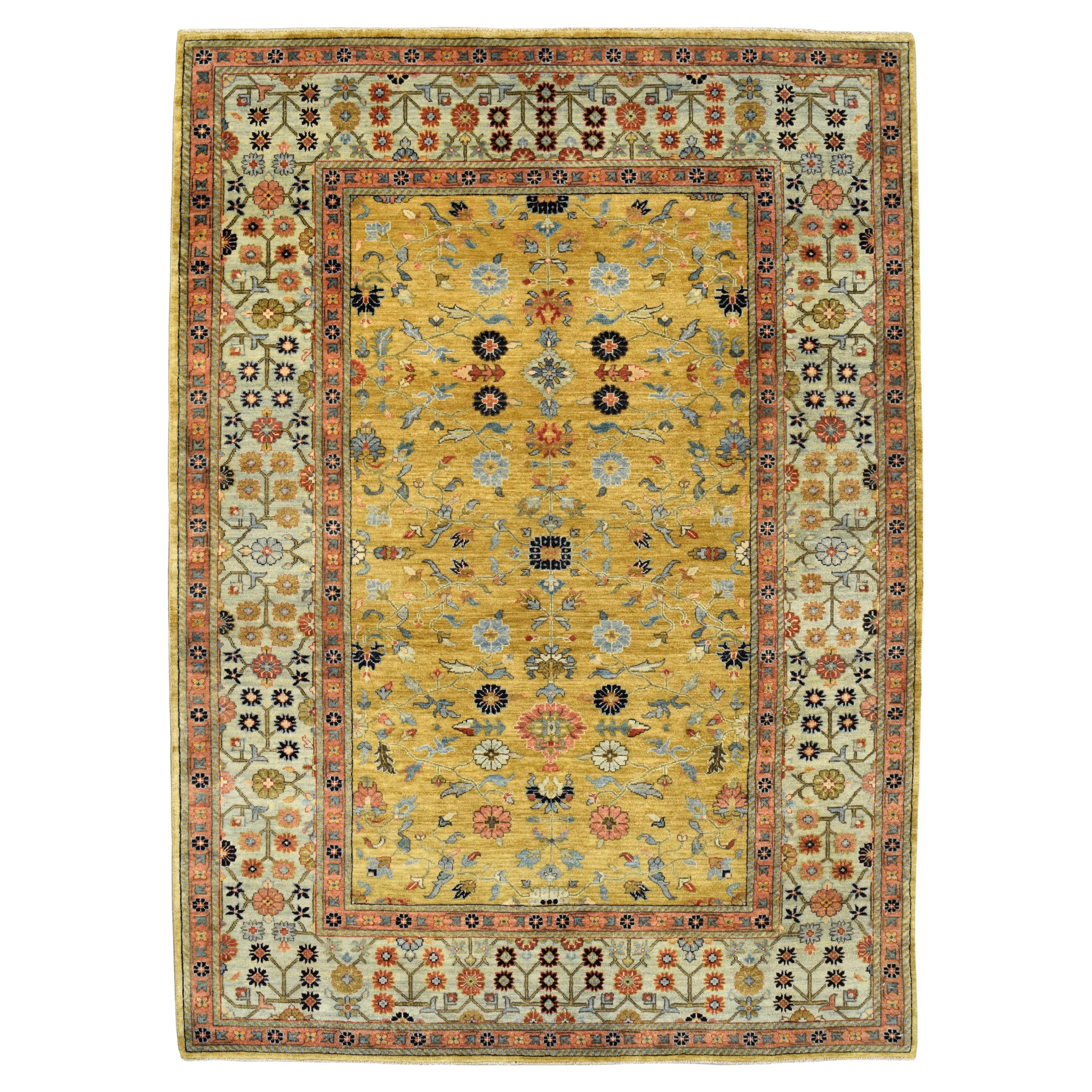 Gold Handknotted Rug with Blue Border, Pink, Green, and Floral Motifs, 6' x 9' For Sale