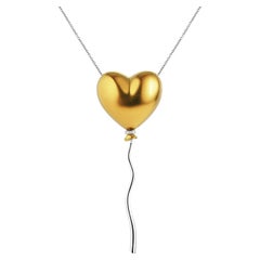 Ciondolo a forma di cuore d'oro con palloncino