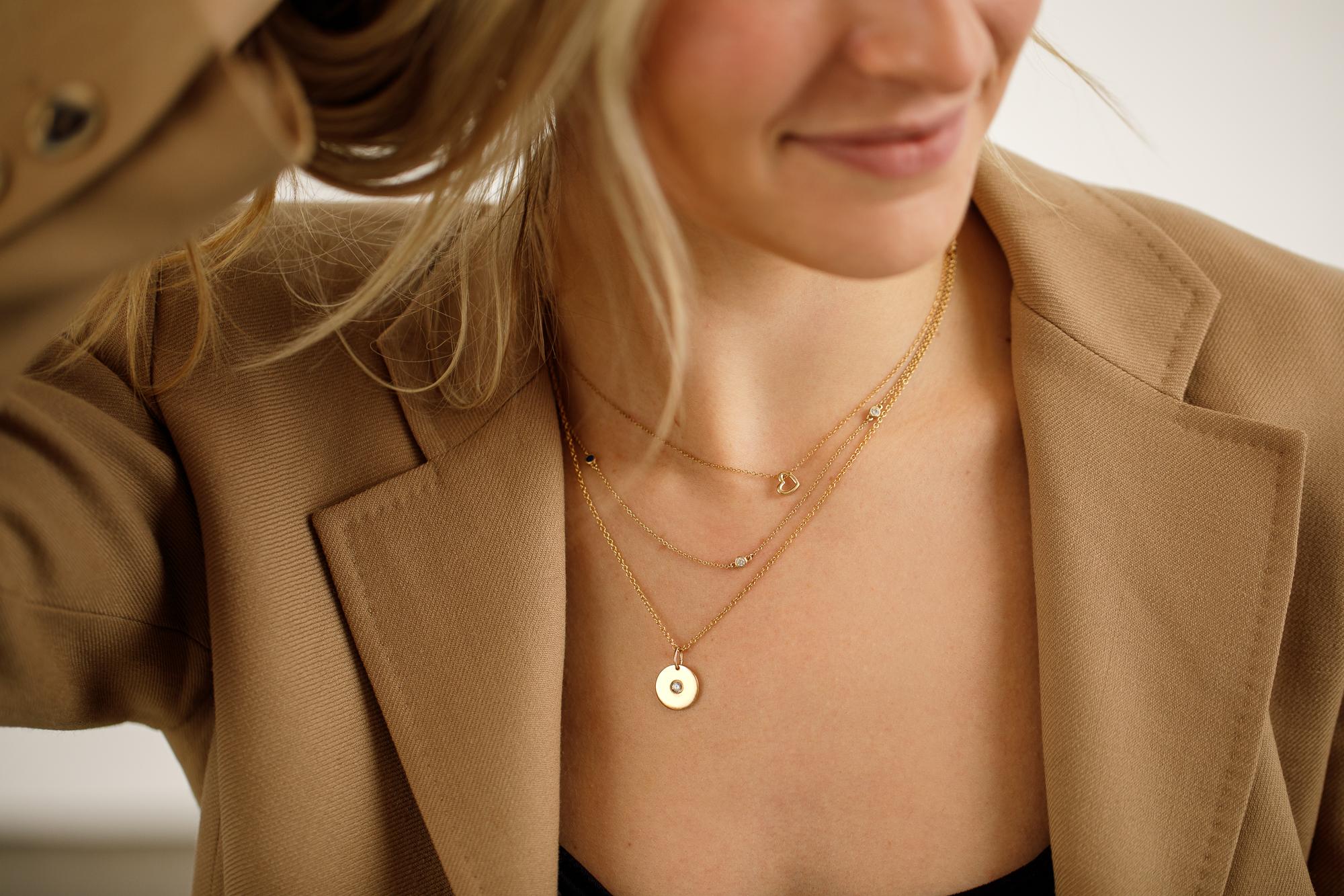 A small, dainty, solid gold heart on a simple 1.2mm curb chain. It really is too cute.

-18k solid gold
-16