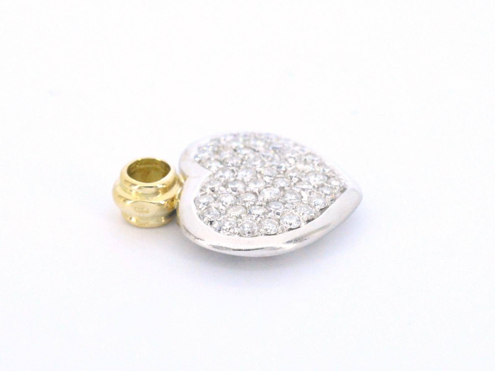 Diamonds: 48 pieces; Weight: 1.00 carat; Cut shape: Brilliant cut; Colour: F-G; Purity: VS; Quality: Good; Jewel: pendant/charm; Weight: 3.7 ounces; Dimensions: 2 x 1.5 cm; Hallmark: 18K gold ; Condition: Vintage; The quality has been taken from the