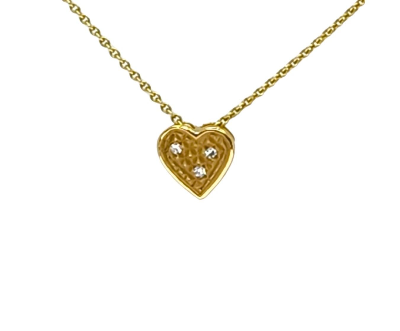 The yellow 18K Gold version of the Heart Slide with the unique Pyramid texture in matte and white diamonds will add a surprise sparkle play. 18K yellow gold adds another dimension in color play to the Heart Slide Necklace. 
The heart slides can be