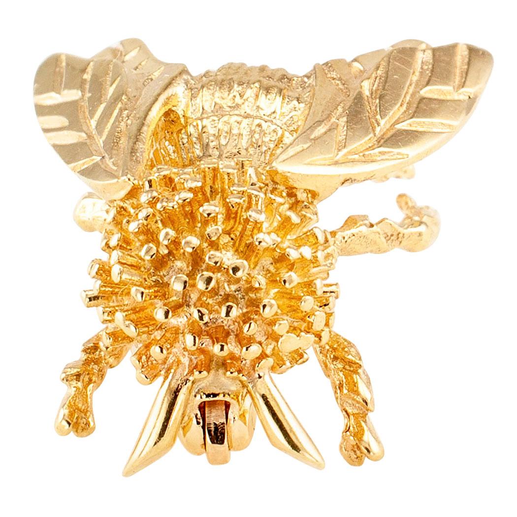 Gold honeybee brooch circa 1980. The 14-karat yellow gold sculptural design depicts a honeybee with an abundance of realistic detail. We love the overall good looks of this honeybee brooch. It is very cute. We also like the idea that honeybees are