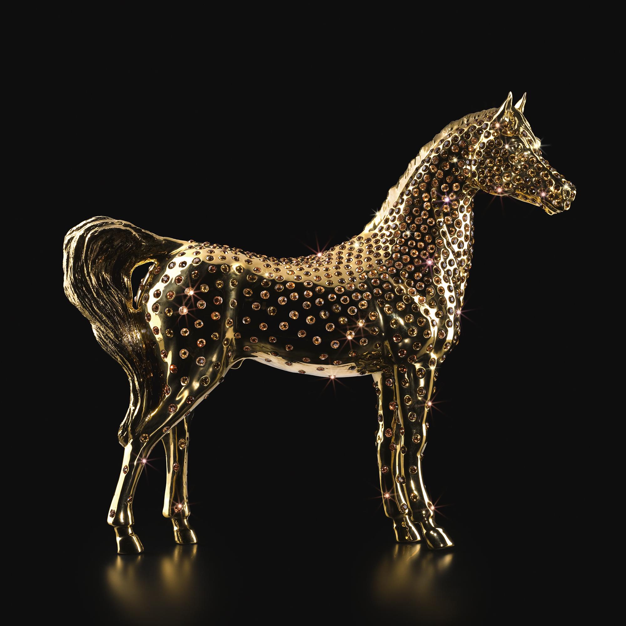 Sculpture gold horse with amber crystals, sculpture all made 
in porcelain and gold plated in 24 karat. With amber carved
small Swarowski crystals meticulously hand-applied. 
Exceptional piece in limited edition of 20 pieces.