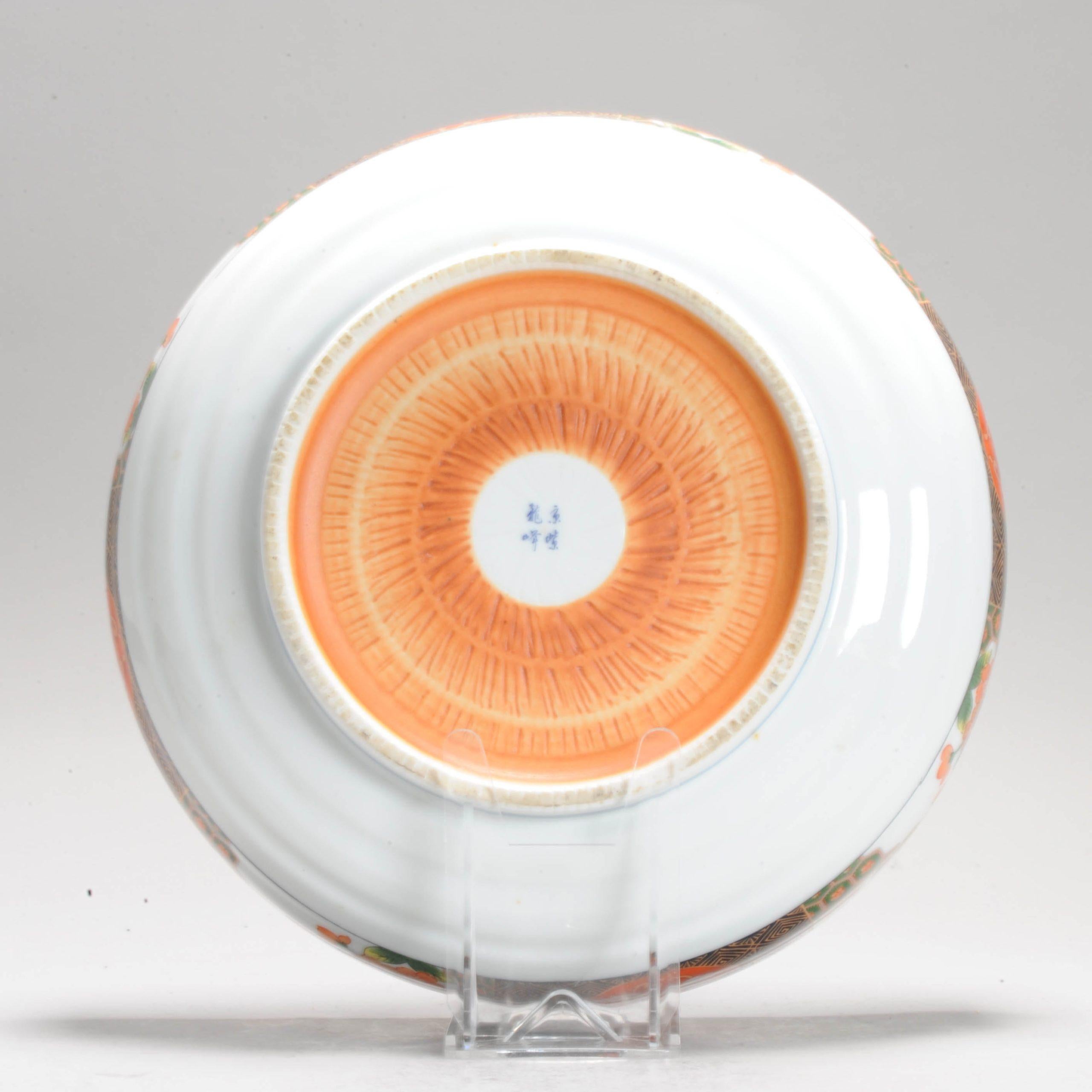 ‘Gold’ Imari, decorated in gold and iron-red, with landscape scene. It has an interesting dent to the rim which was intentional. Not sure what the purpose is.

Can be used as a Fruit bowl.

Additional information:
Material: Porcelain &