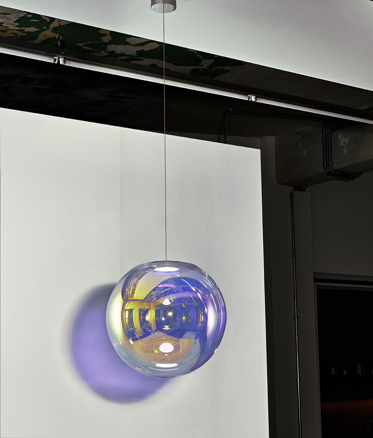 Gold-Indigo Iris Globe 40 by Sebastian Scherer
Handmade
Dimensions: Ø 40cm. 
Design: Sebastian Scherer
Material: Dichroic-coated mouth-blown glass, stainless steel.
Color: gold-indigo

Available in gold-indigo, blue-orange, pink-green, cyan-magenta,