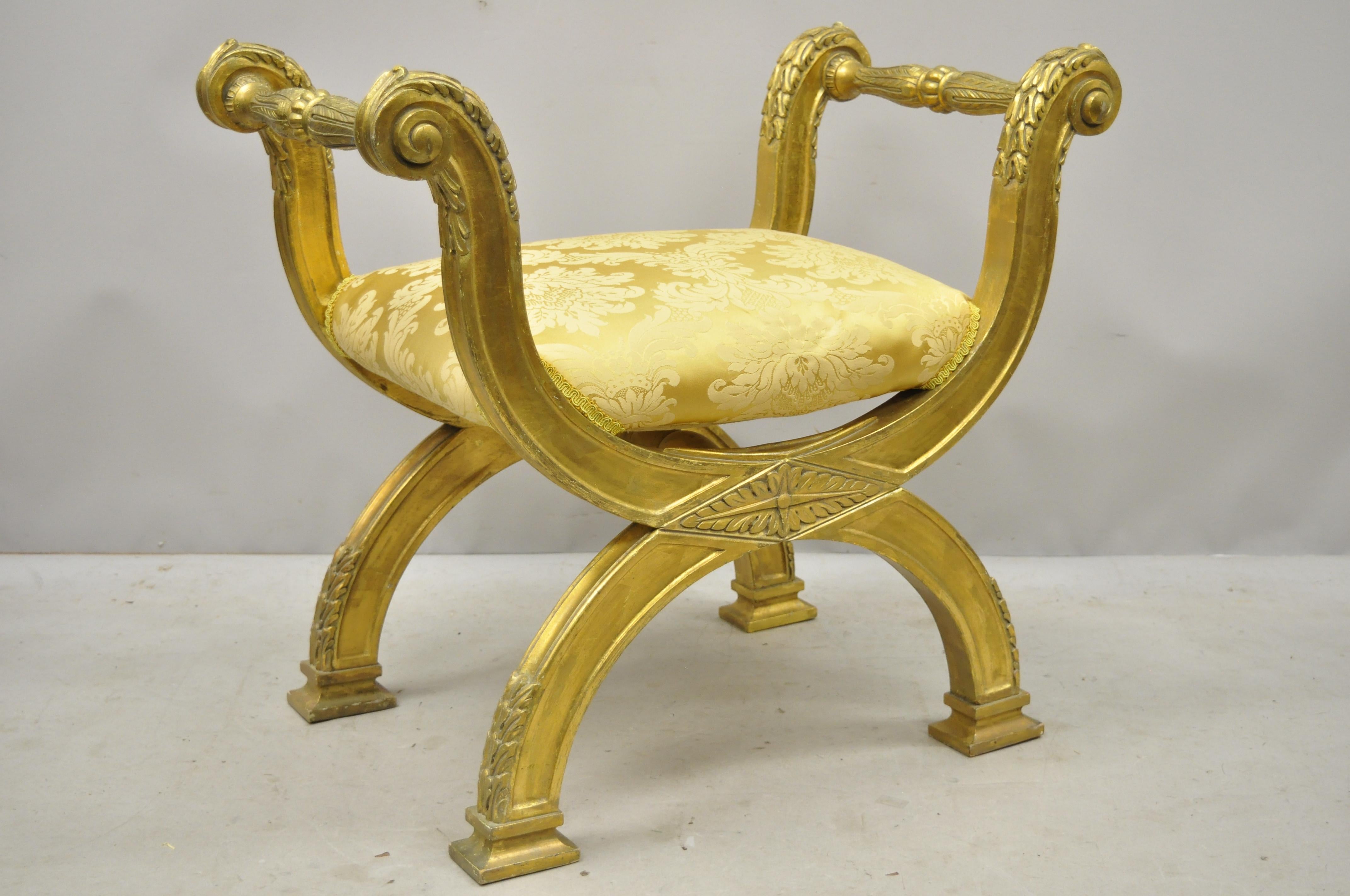 Gold Italian neoclassical style giltwood carved curule bench attributed to Maitland Smith. Item features solid wood frame, gold distressed finish, nicely carved details, very nice vintage item, great style and form. Maker unconfirmed but possibly by