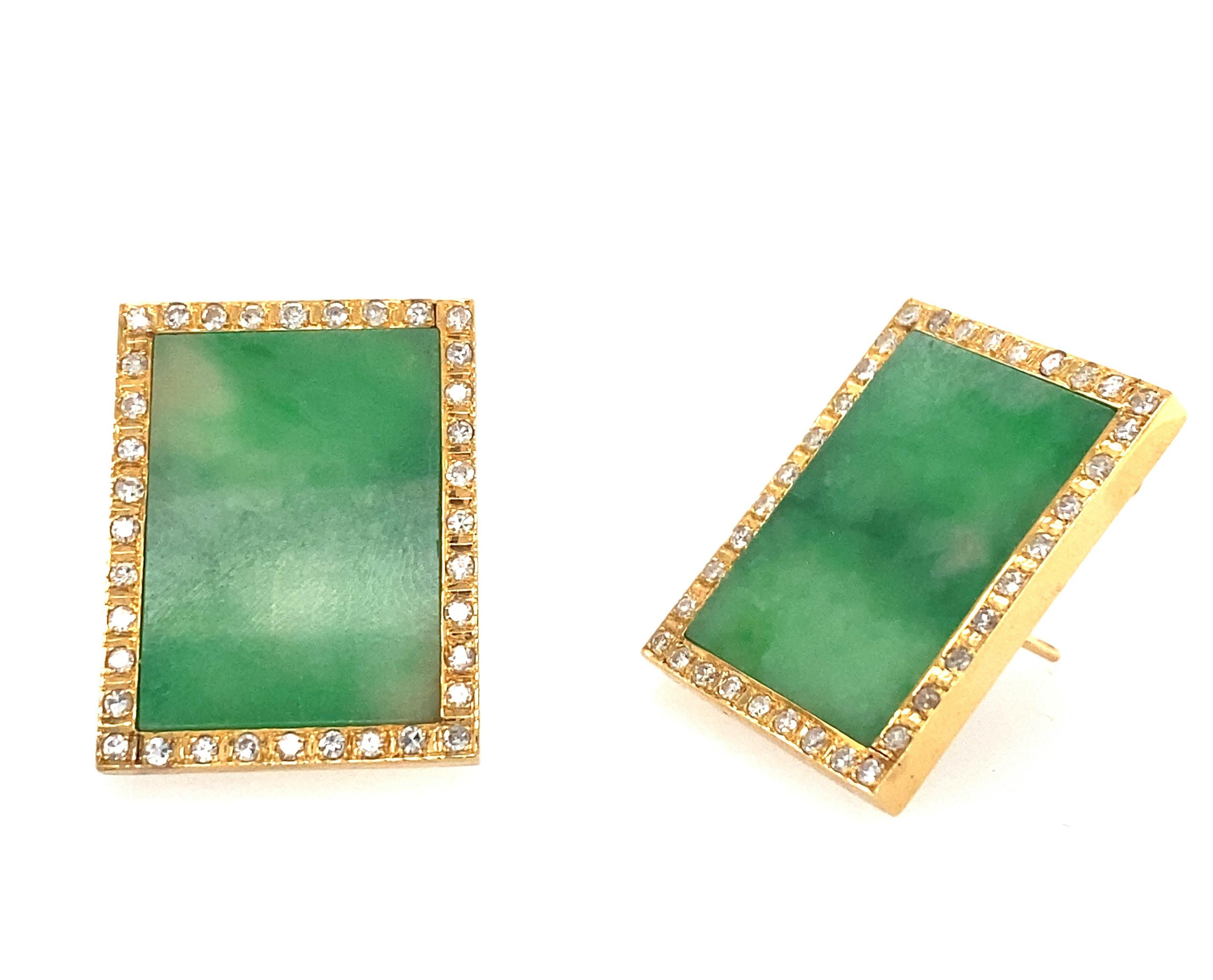 Pair of Gold, Jade and Diamond Earrings
14 kt., 2 rectangular jade plaques  ap. 22.0 x 18.0 mm., 
72 single-cut diamonds ap. 1.05 cts., 
ap. 13.6 dwts. gross. Posts and clip-backs. 1 1/8 x 7/8 inches.