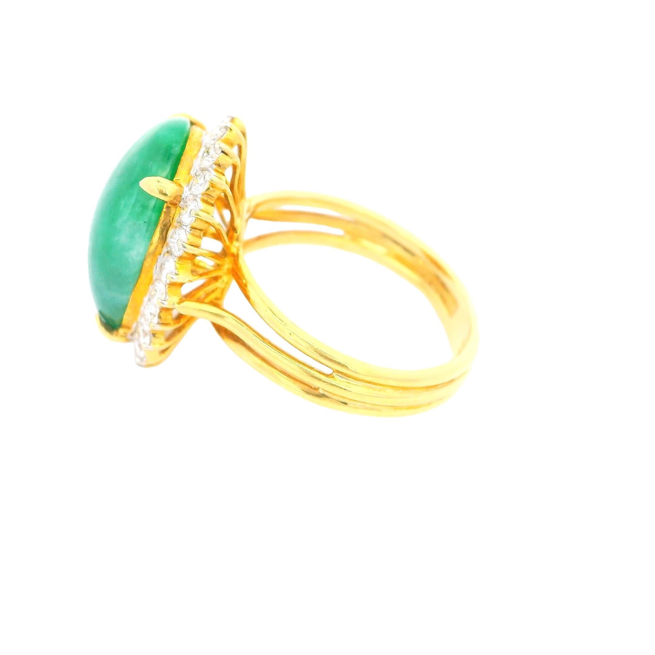 21st Century

This elegant ring is crafted in gold. It features a striking green jade cabochon weighing 10.65 carats, surrounded by round white diamonds totaling 0.75 carats (I color, SI1 clarity).

The jade and diamond cluster is set in a classic