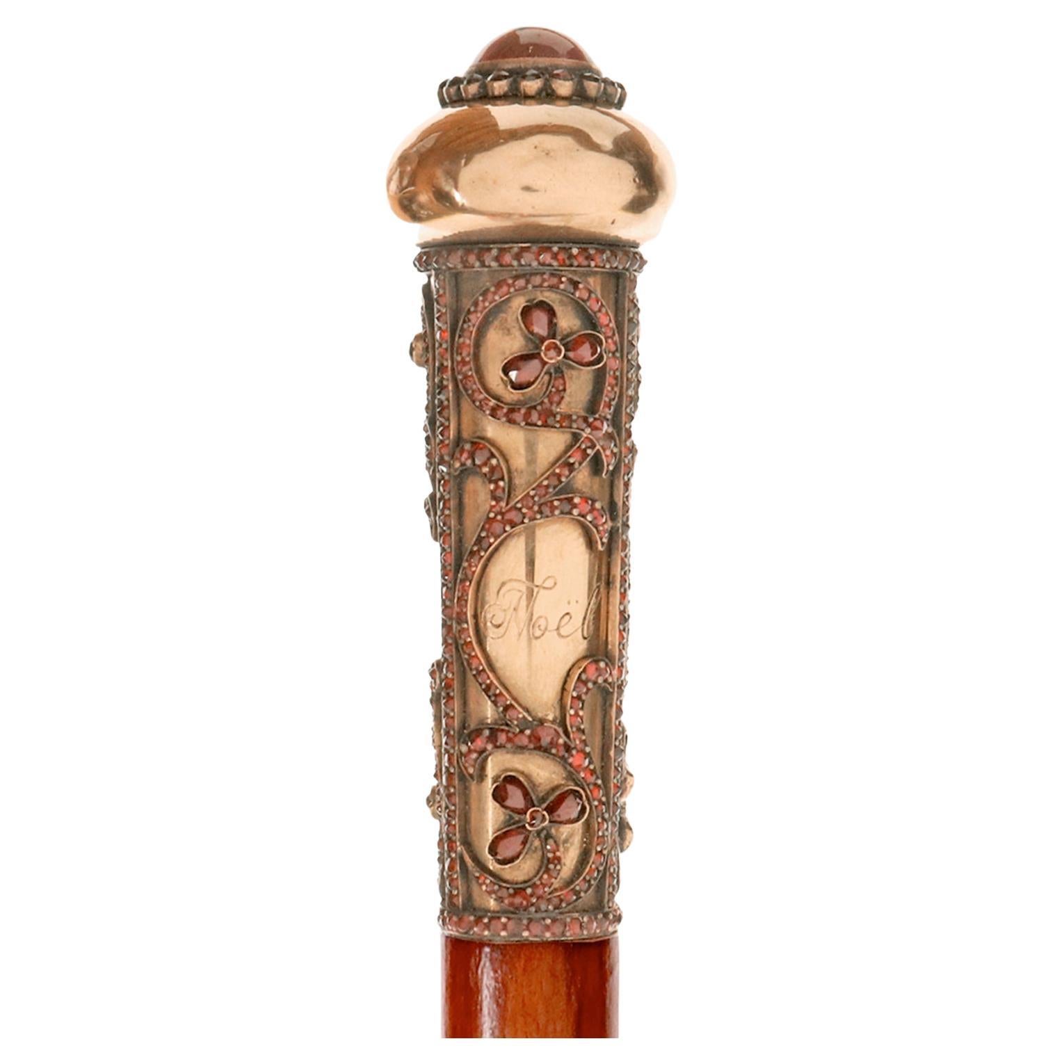 Bâton de marche en or avec pierre en grenat. Par Antoine Bricteux, France 1901. en vente